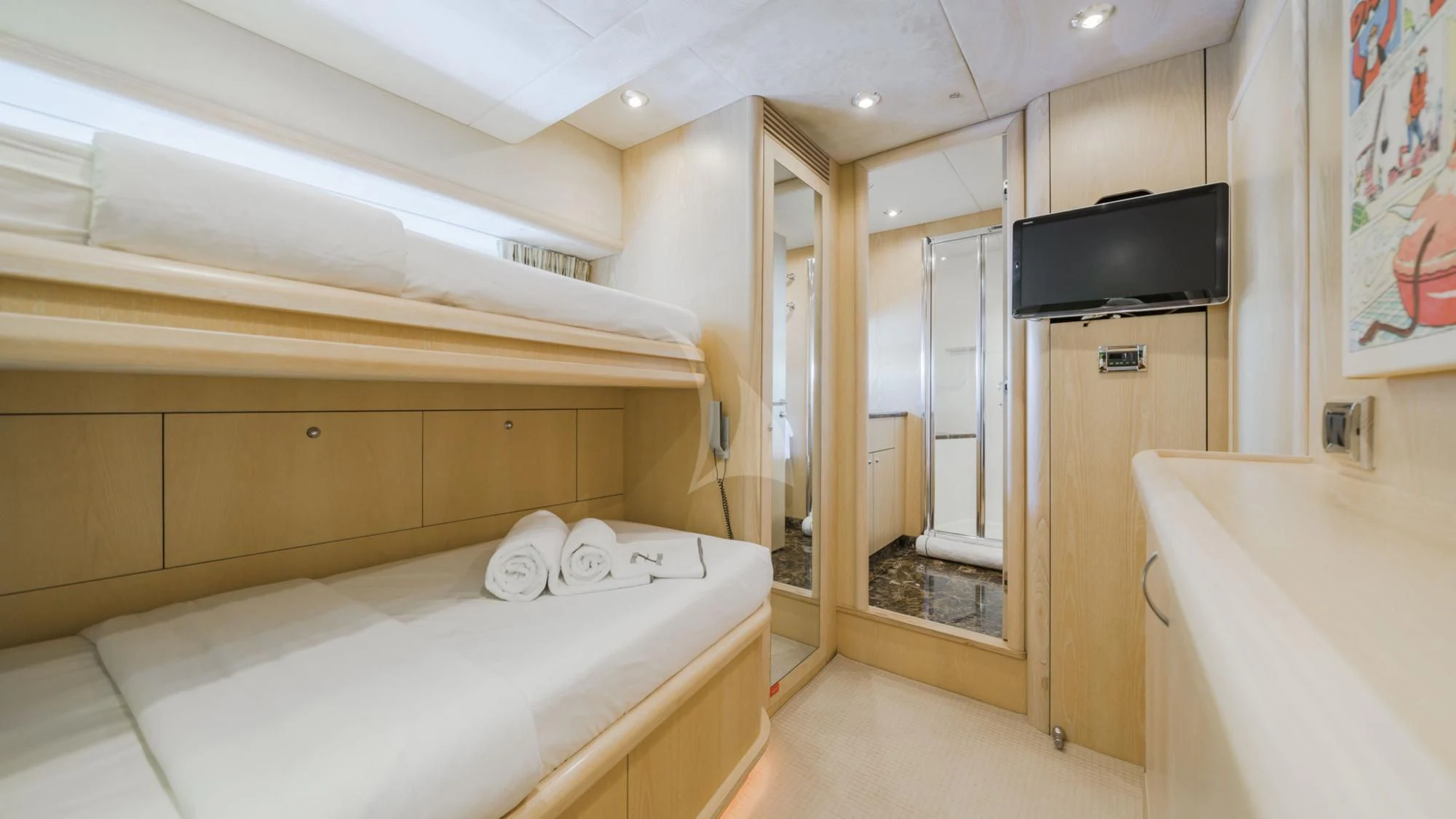 a room with a bed and tv aboard CAPPUCCINO Yacht for Sale