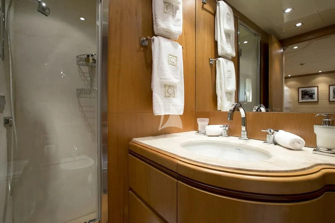 a bathroom with a sink and a mirror aboard CAPPUCCINO Yacht for Sale