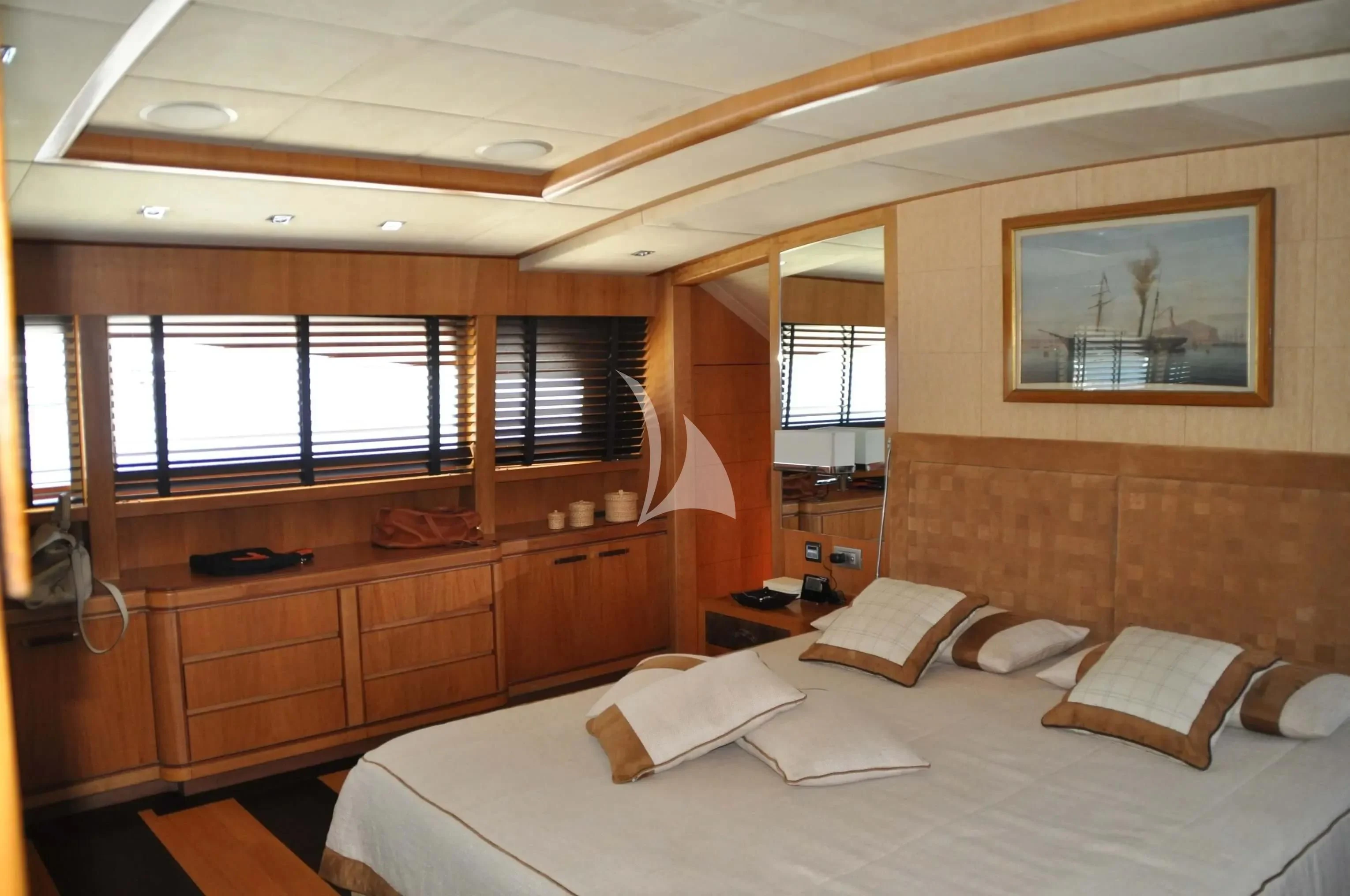 a room with a bed and a window aboard CAPPUCCINO Yacht for Sale