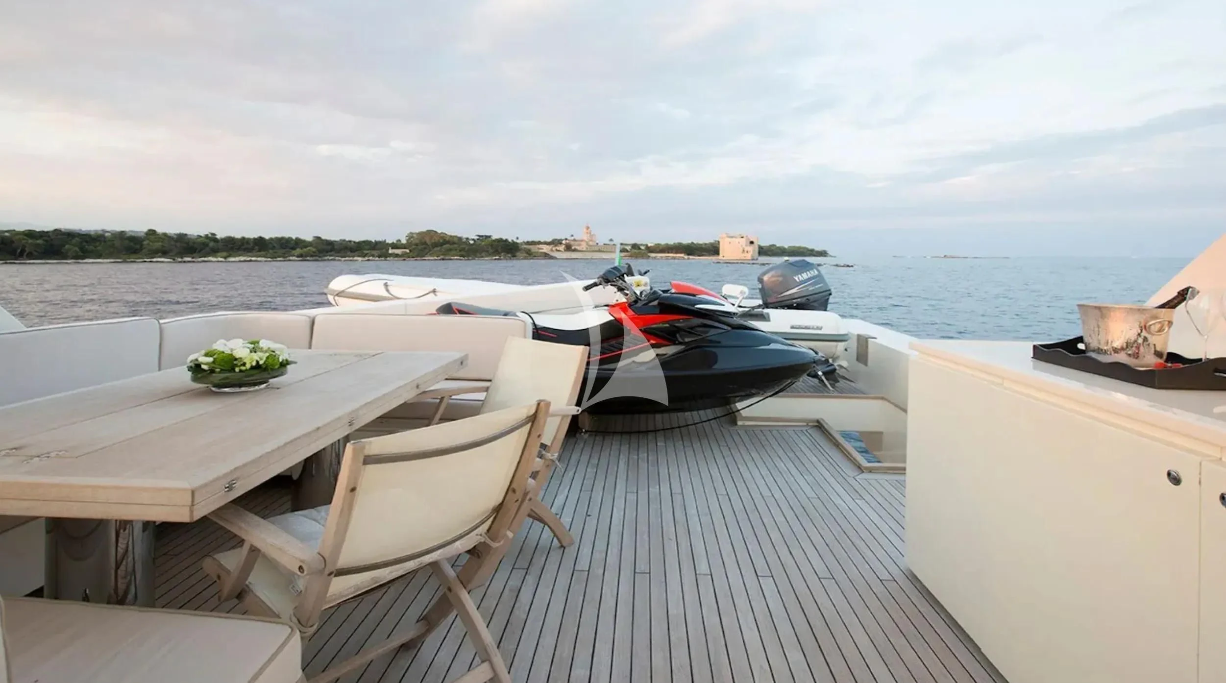 a table and chairs on a boat aboard CAPPUCCINO Yacht for Sale