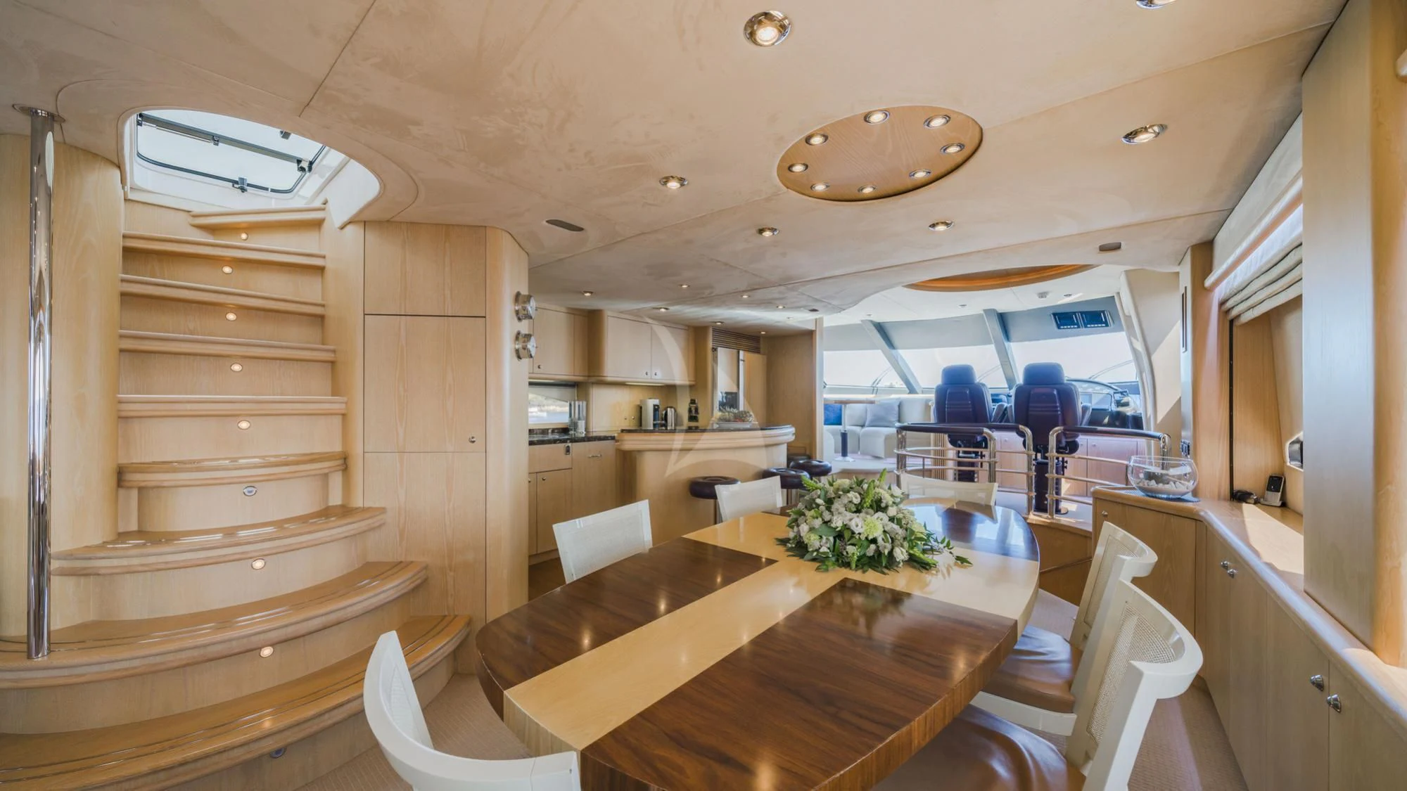 a large open kitchen and dining area aboard CAPPUCCINO Yacht for Sale