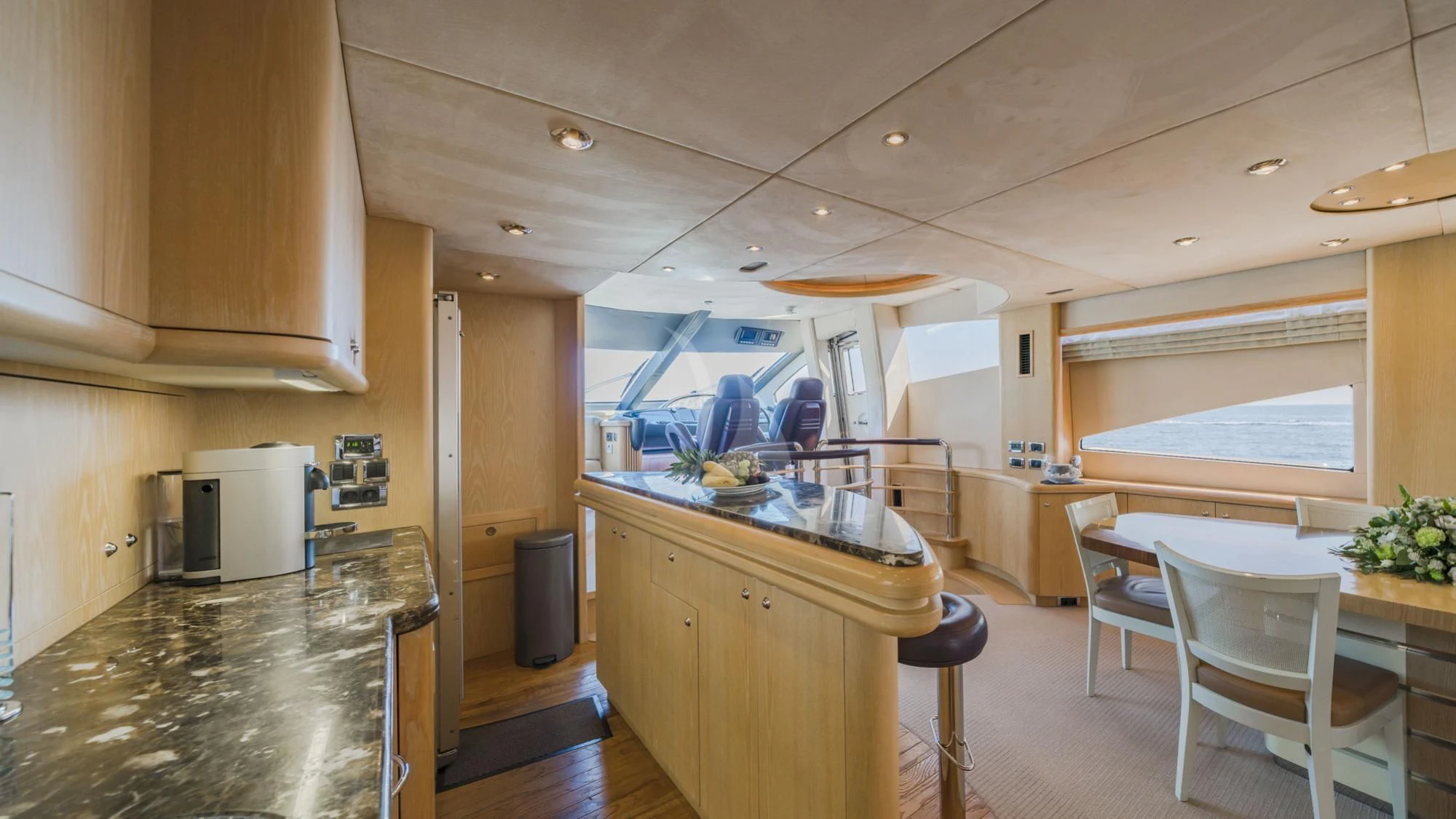 a kitchen with a large island aboard CAPPUCCINO Yacht for Sale