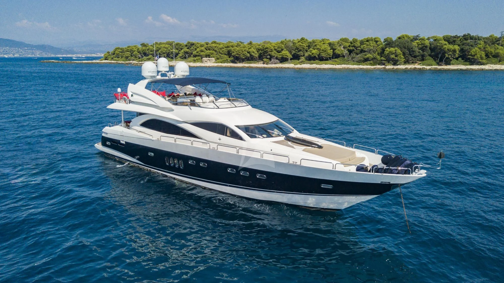 a white boat on the water aboard CAPPUCCINO Yacht for Sale