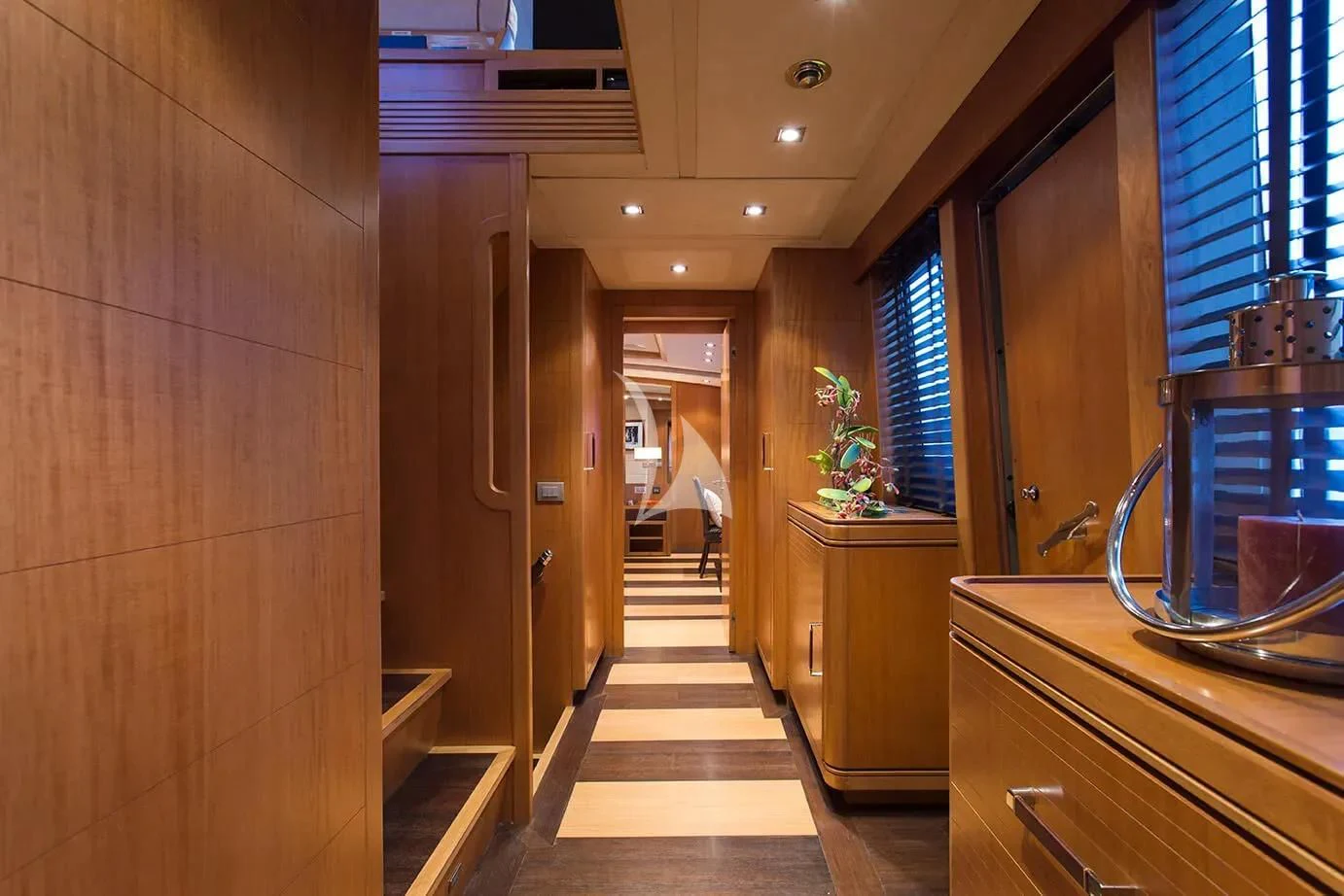 a hallway with a door and a window aboard CAPPUCCINO Yacht for Sale