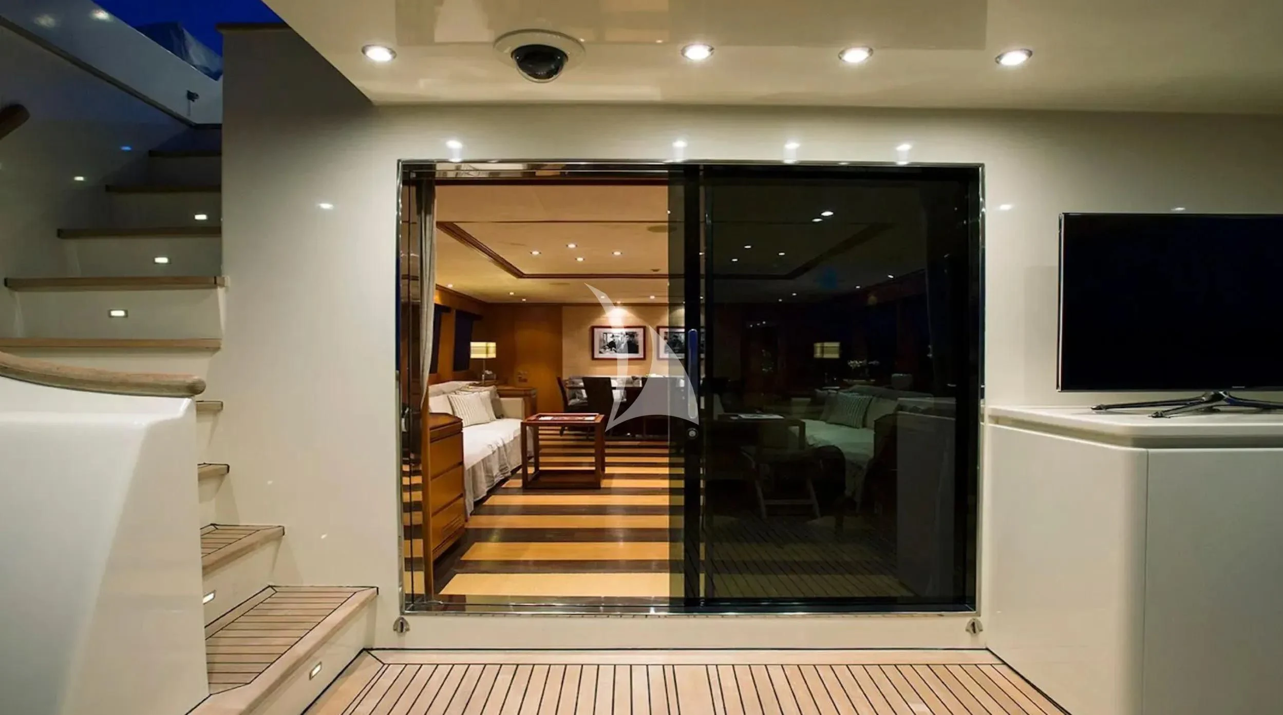 a room with a tv and a bed aboard CAPPUCCINO Yacht for Sale