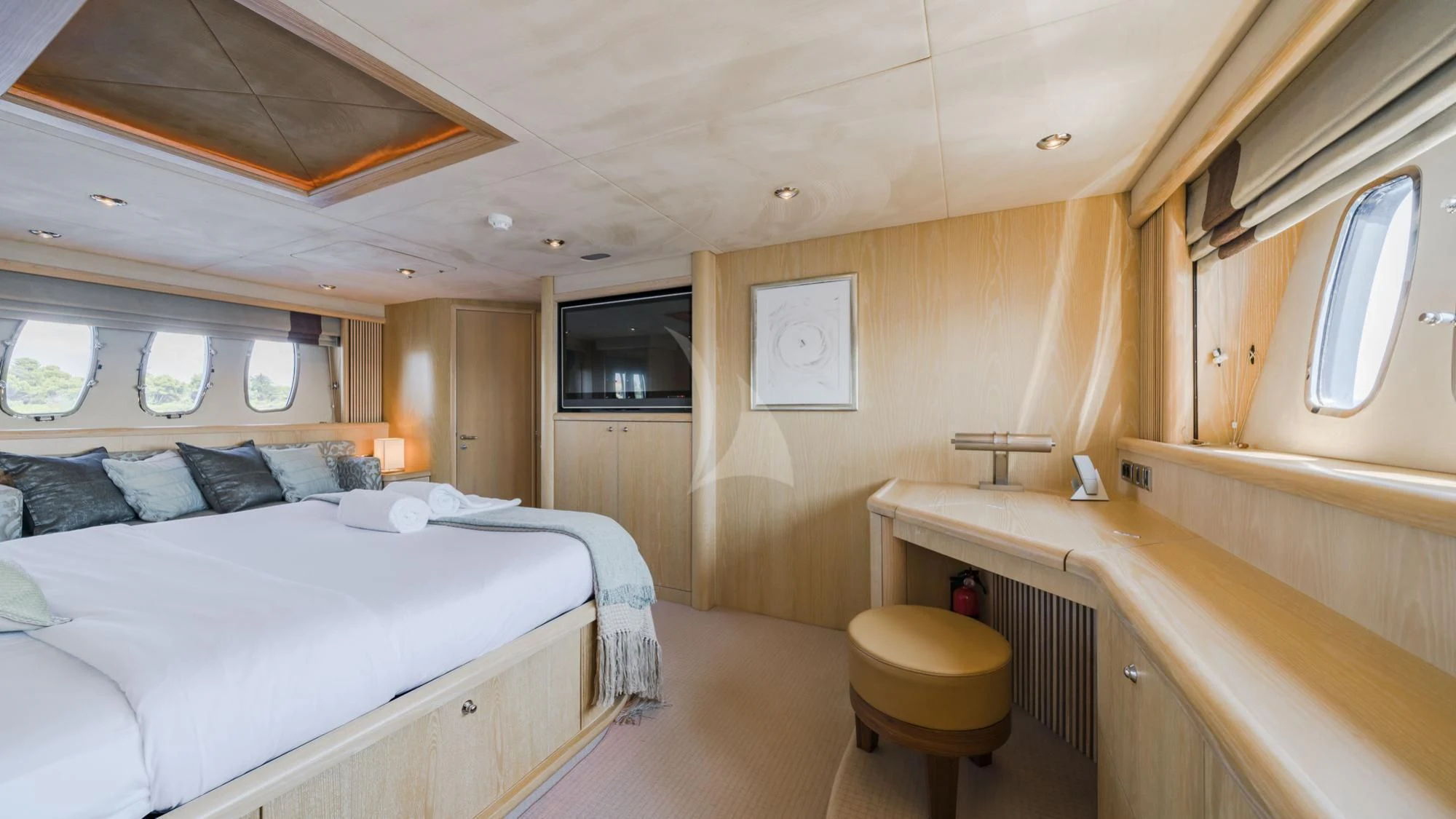 a room with a bed and a television aboard CAPPUCCINO Yacht for Sale