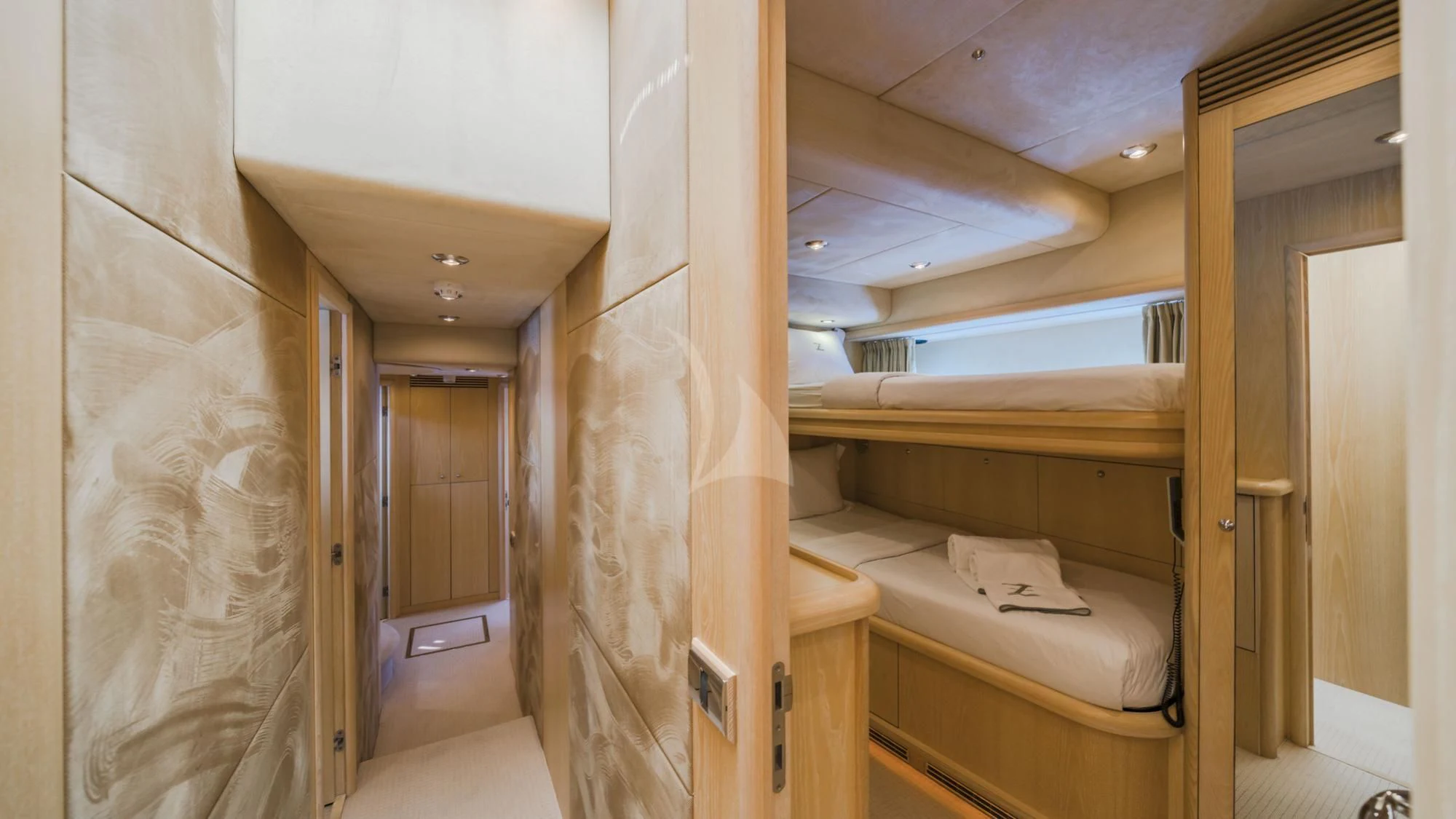 a room with a bed and a closet aboard CAPPUCCINO Yacht for Sale