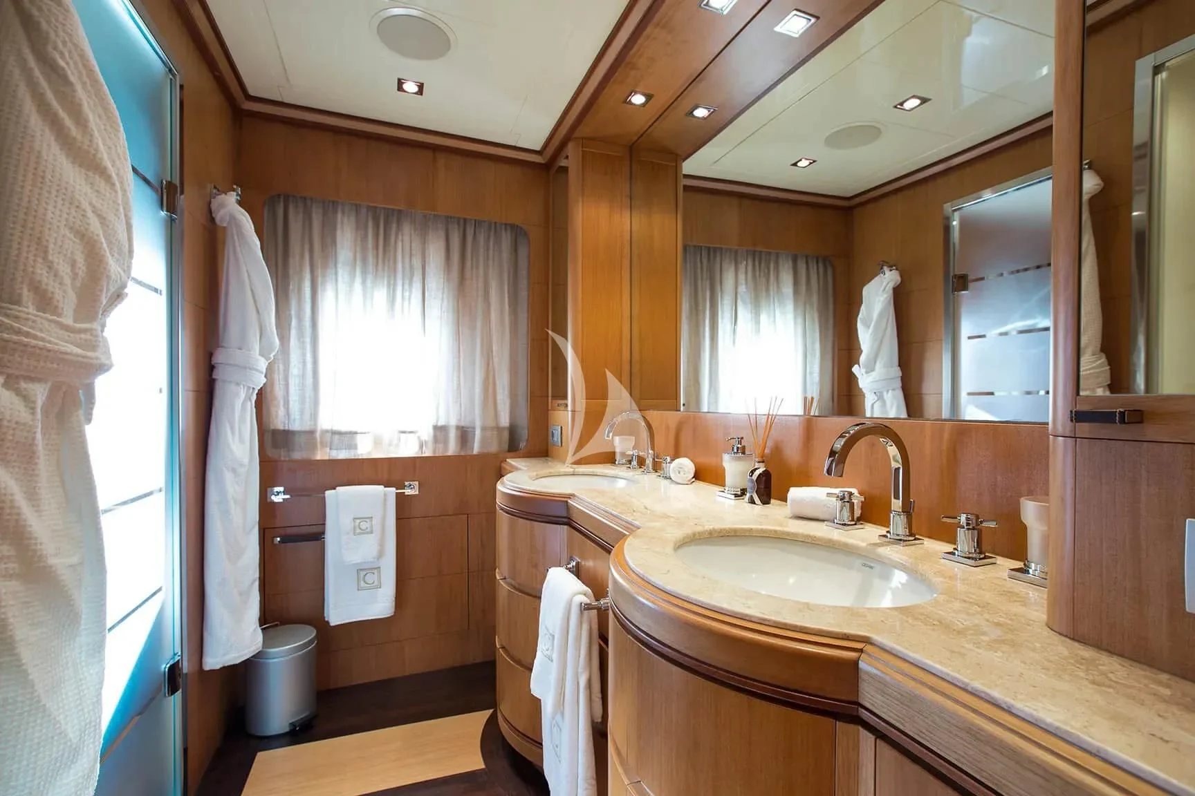 a bathroom with a sink and a mirror aboard CAPPUCCINO Yacht for Sale