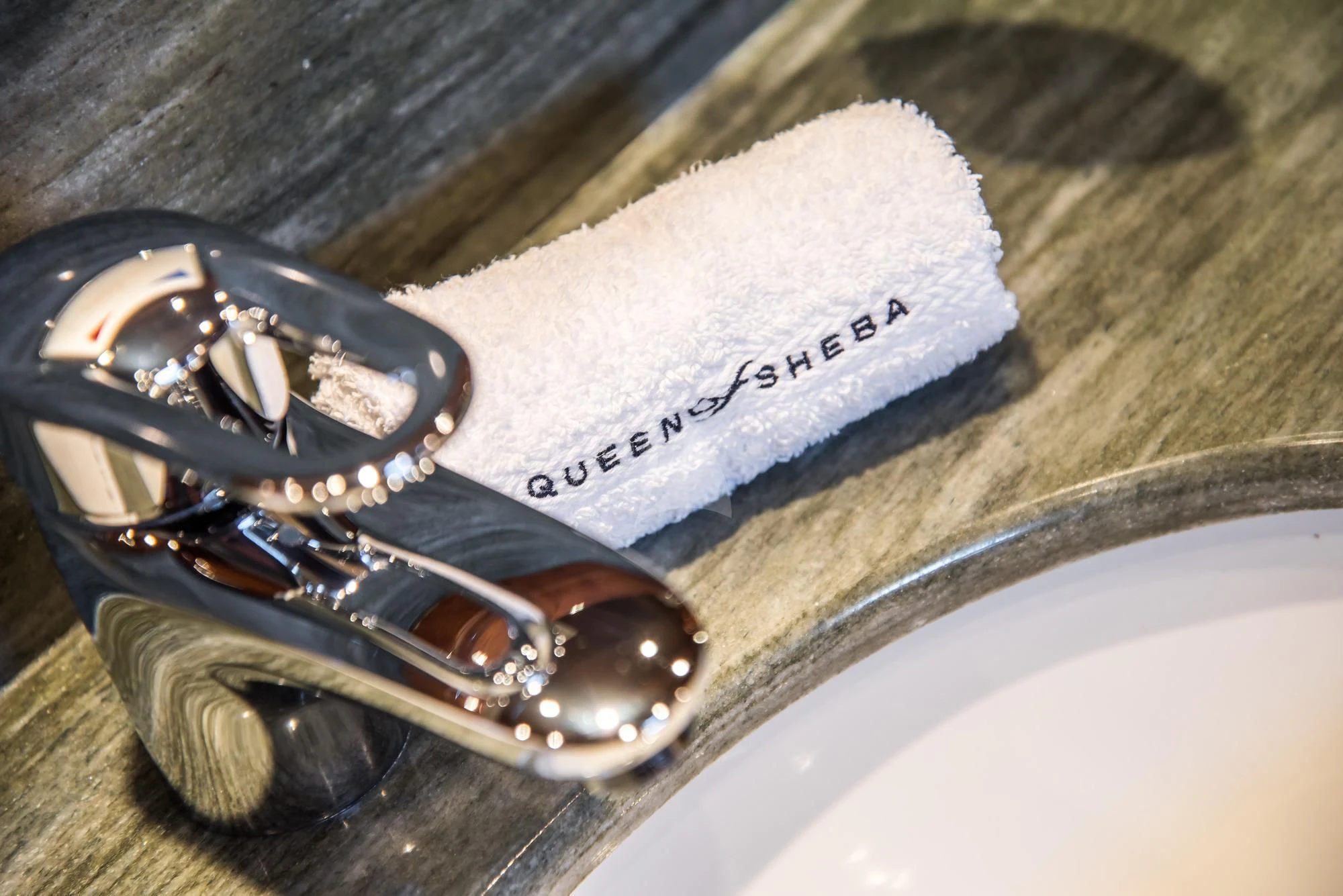 a pair of sunglasses on a book aboard QUEEN OF SHEBA Yacht for Sale