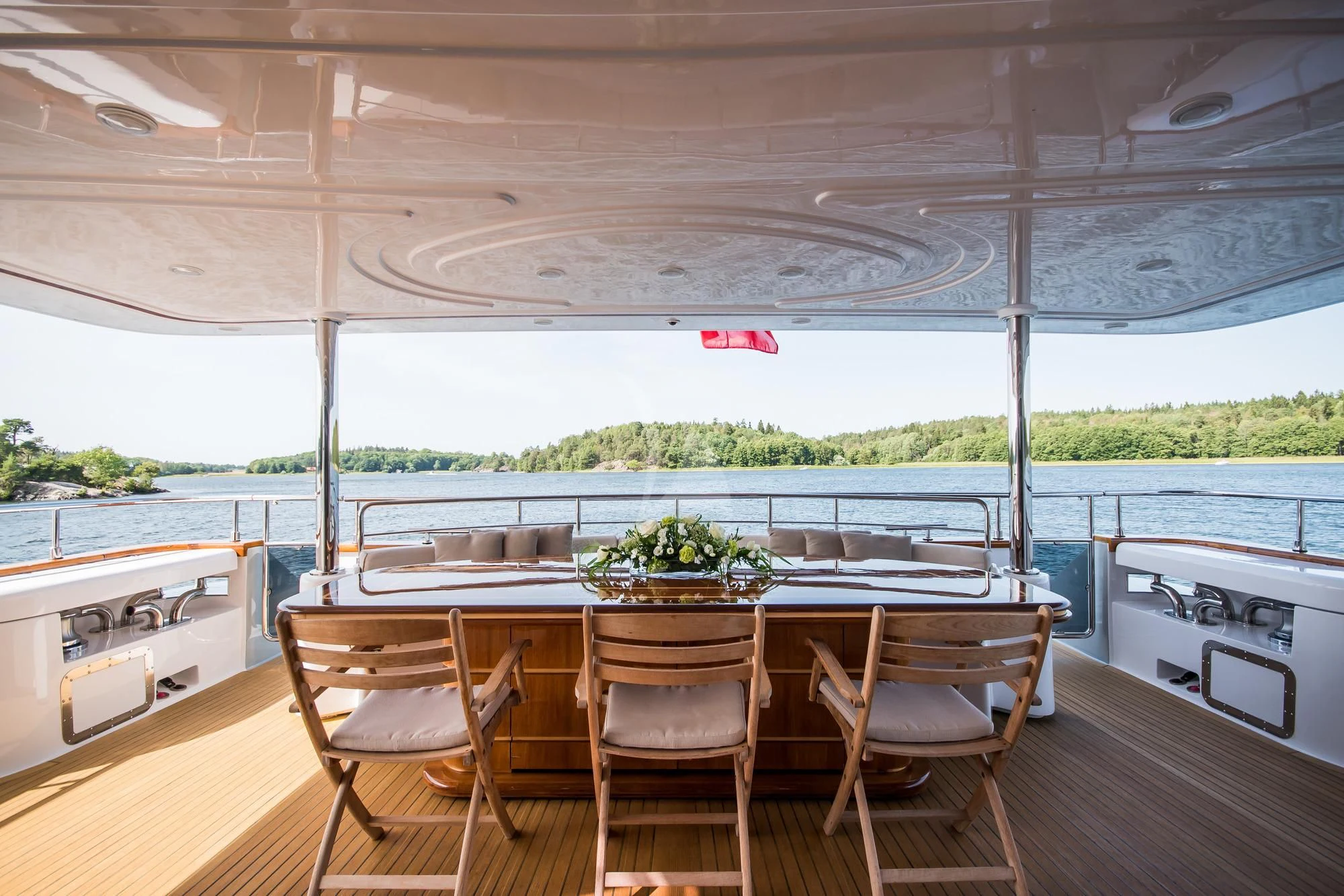 a table and chairs on a deck aboard QUEEN OF SHEBA Yacht for Sale