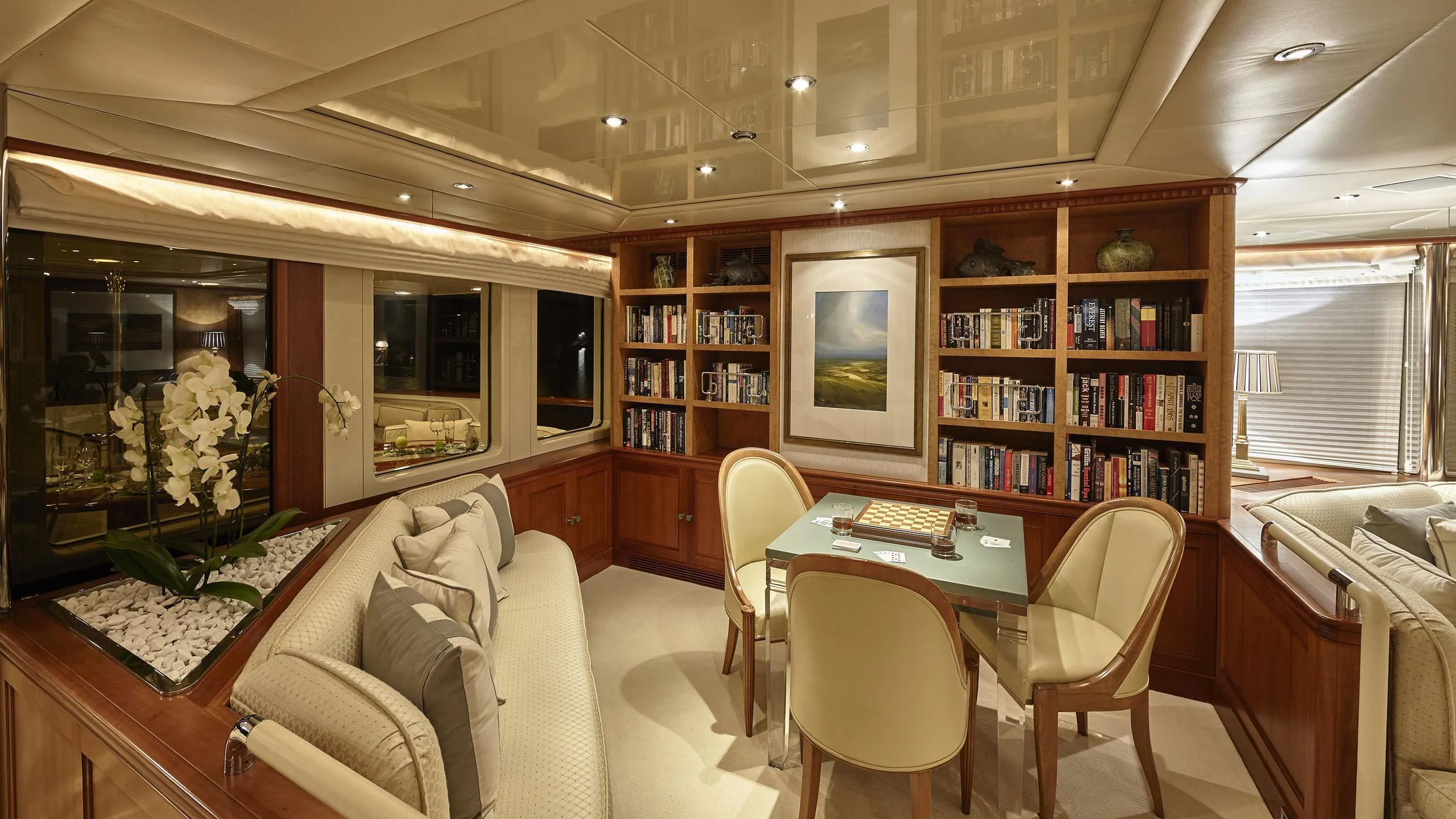 a living room with a table and chairs aboard AZUL V Yacht for Charter