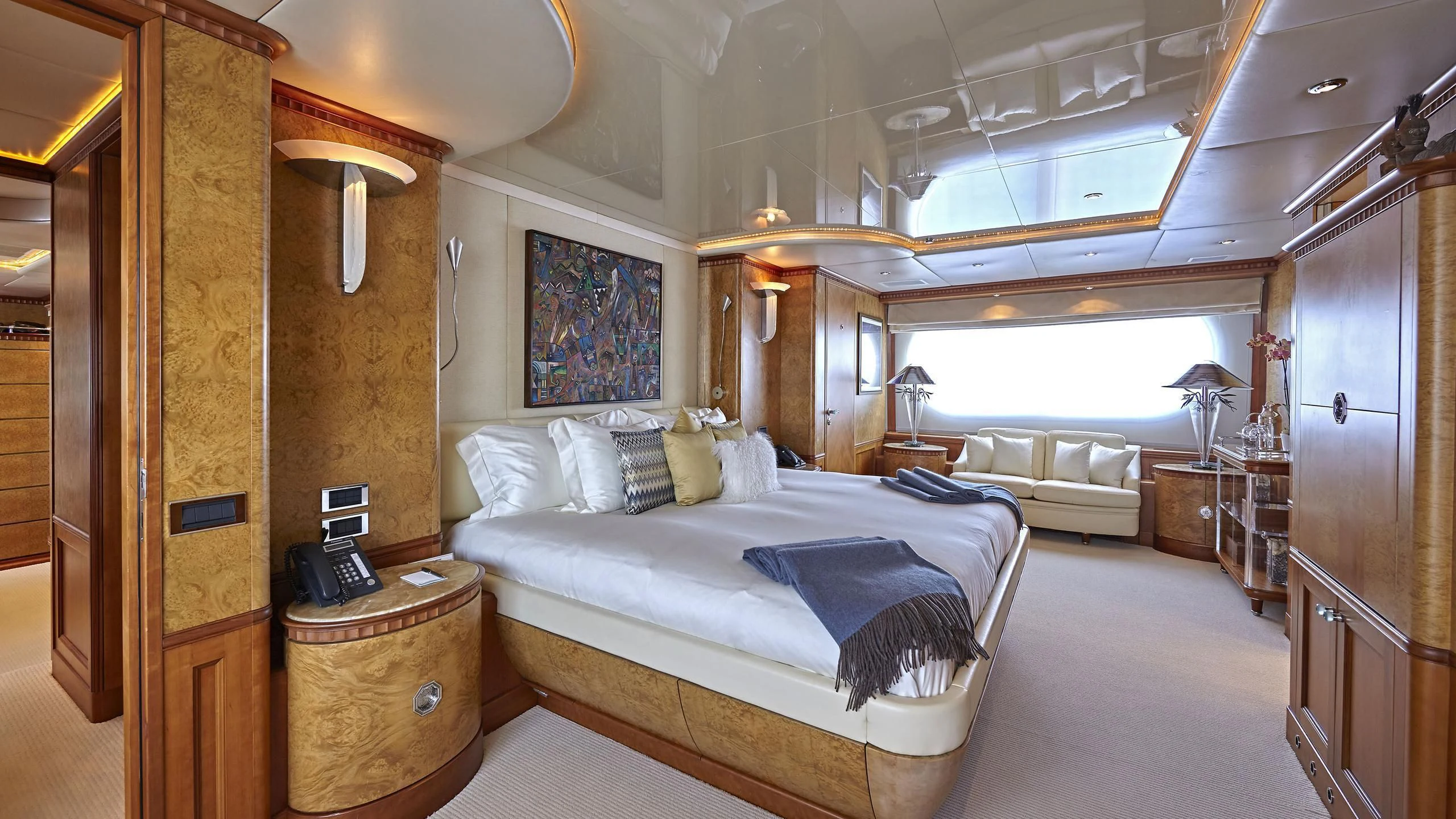 a room with a bed and a desk aboard AZUL V Yacht for Charter