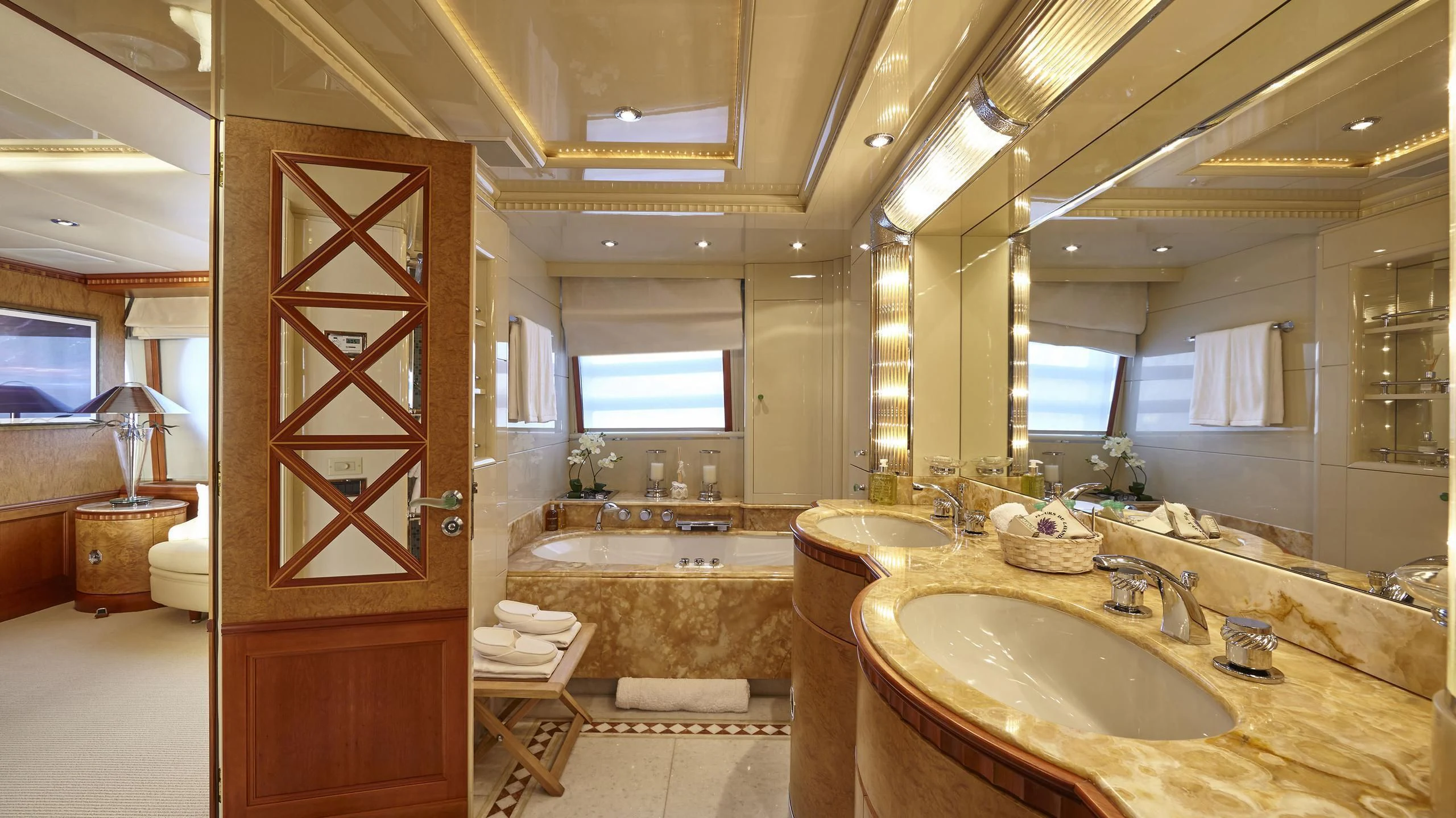 a bathroom with a sink and a mirror aboard AZUL V Yacht for Charter