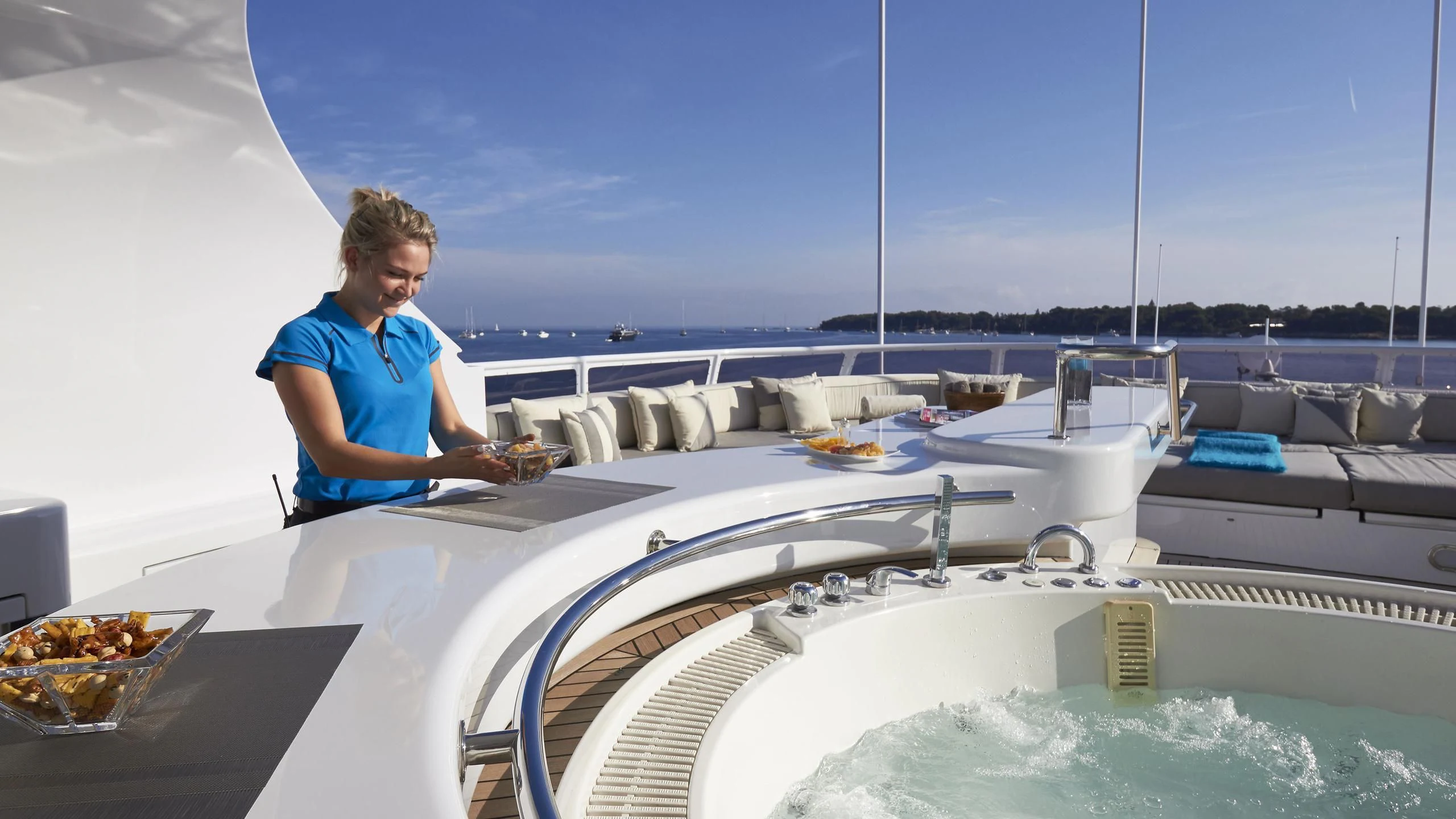 a person sitting on a boat aboard AZUL V Yacht for Charter