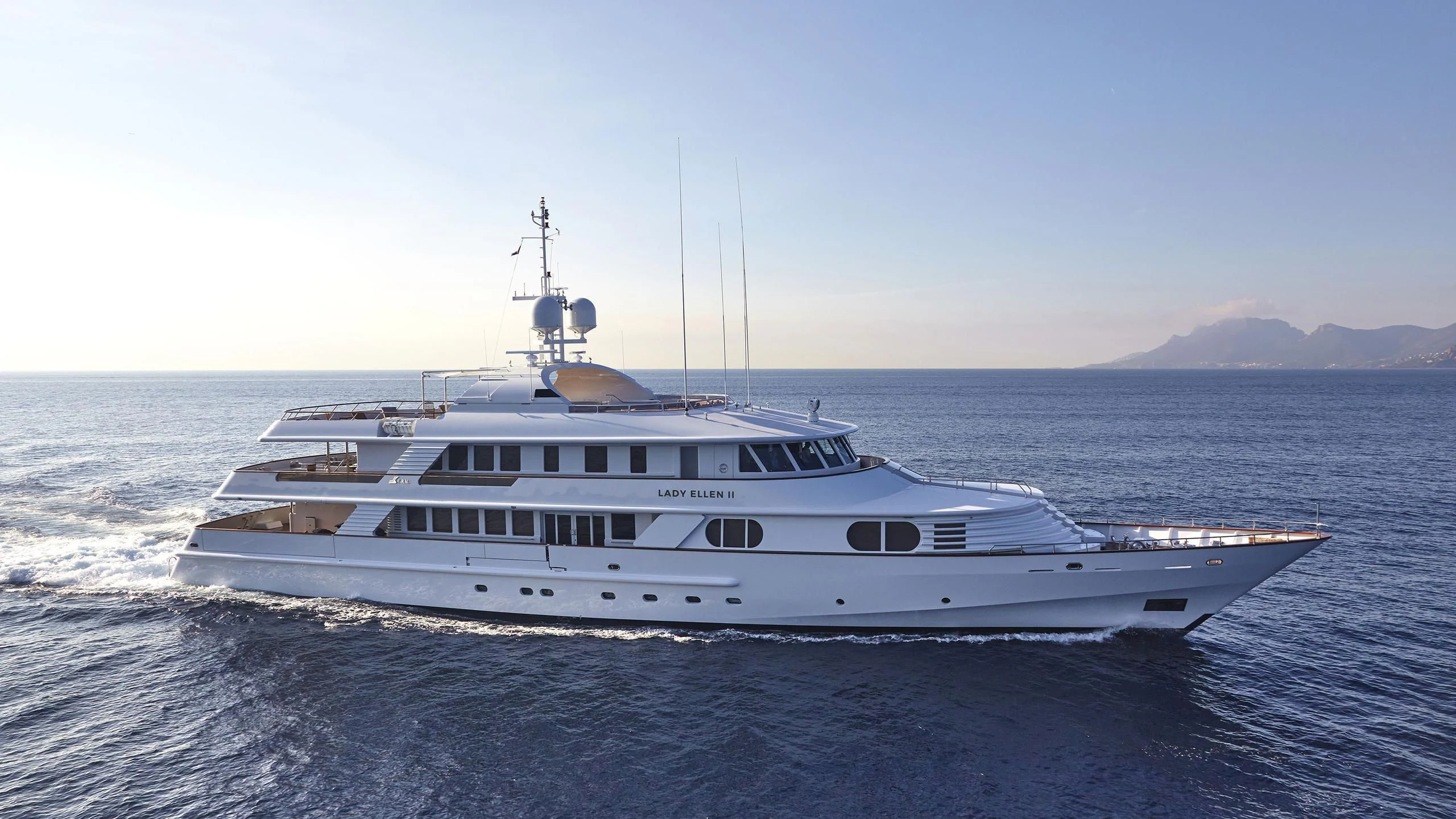 a large white boat in the water aboard AZUL V Yacht for Charter