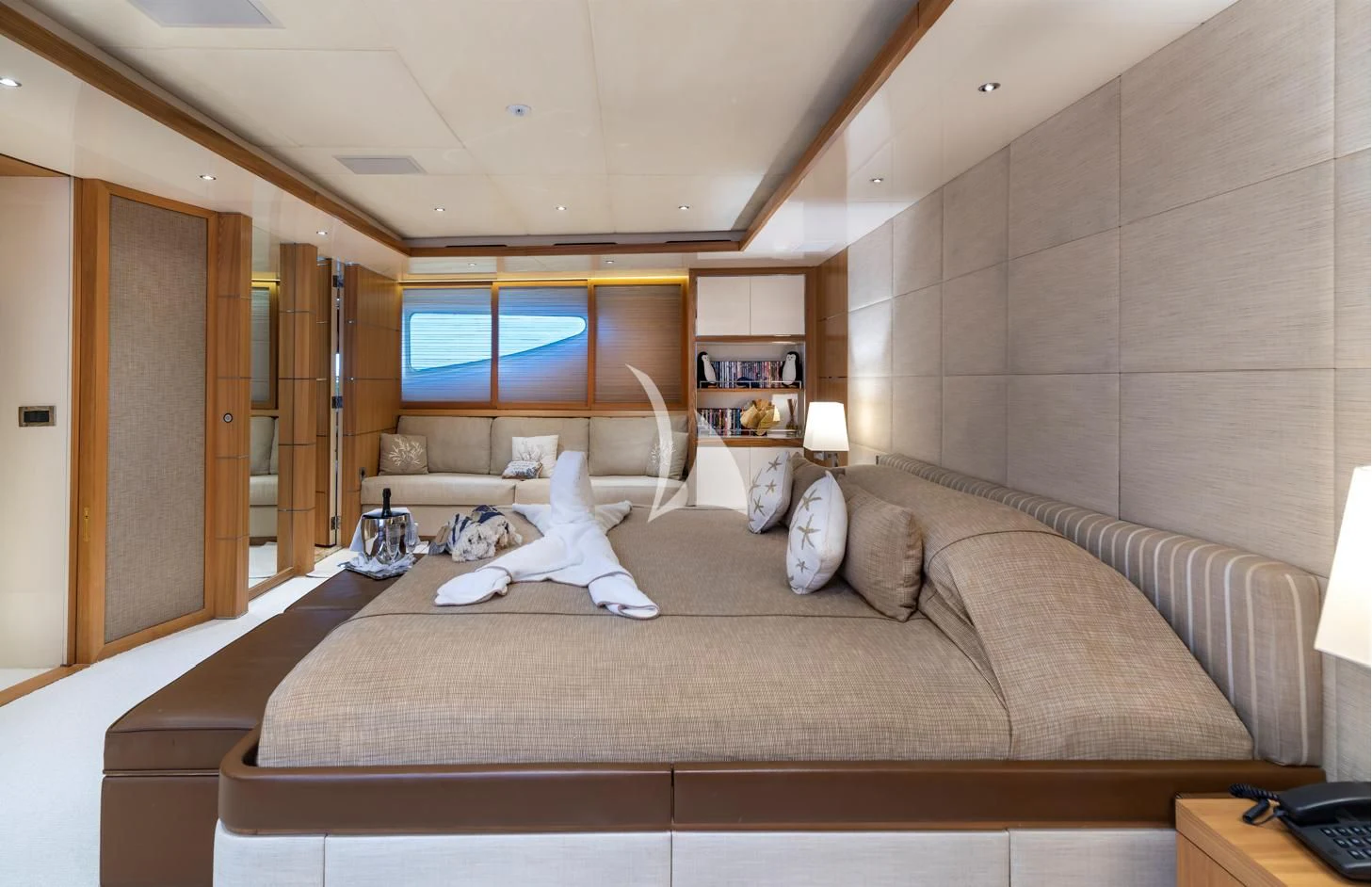 a dog lays on a bed aboard IRAVATI Yacht for Sale
