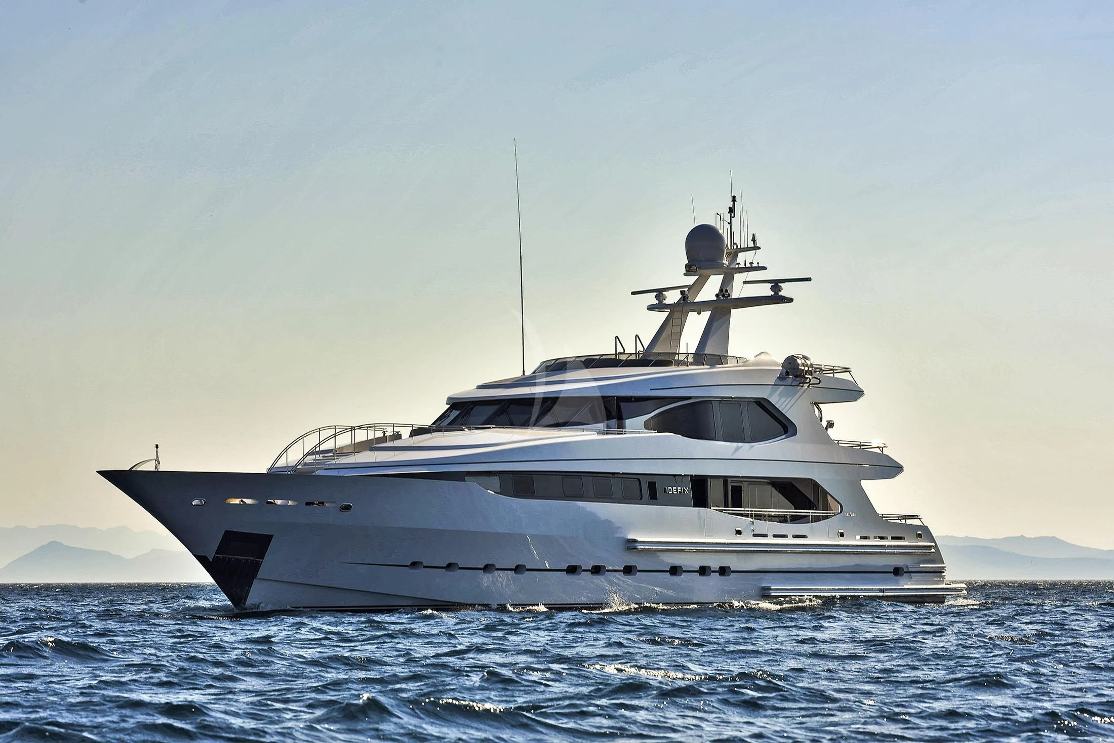 a white yacht in the water aboard IRAVATI Yacht for Sale