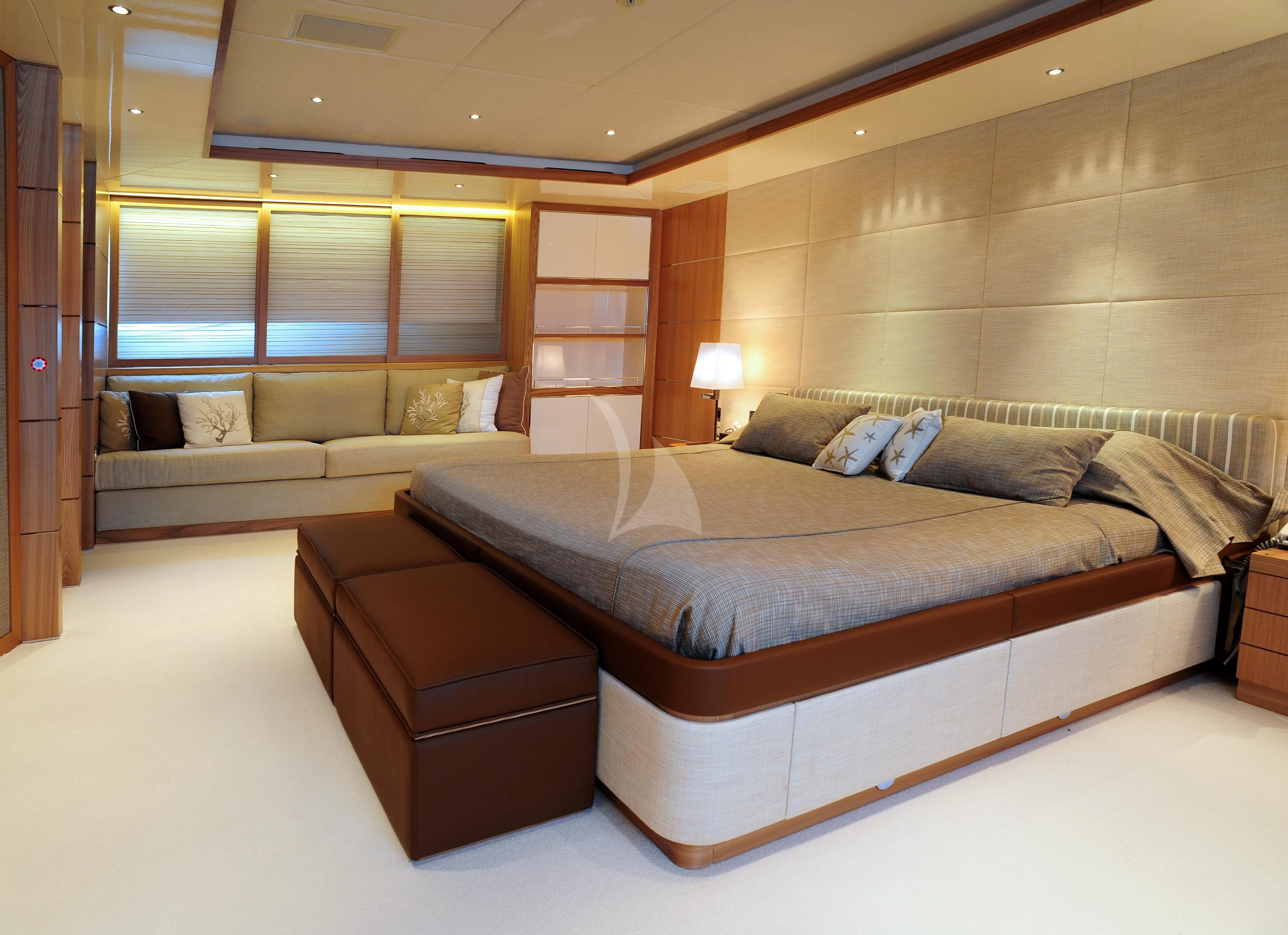 a large bed in a room aboard IRAVATI Yacht for Sale