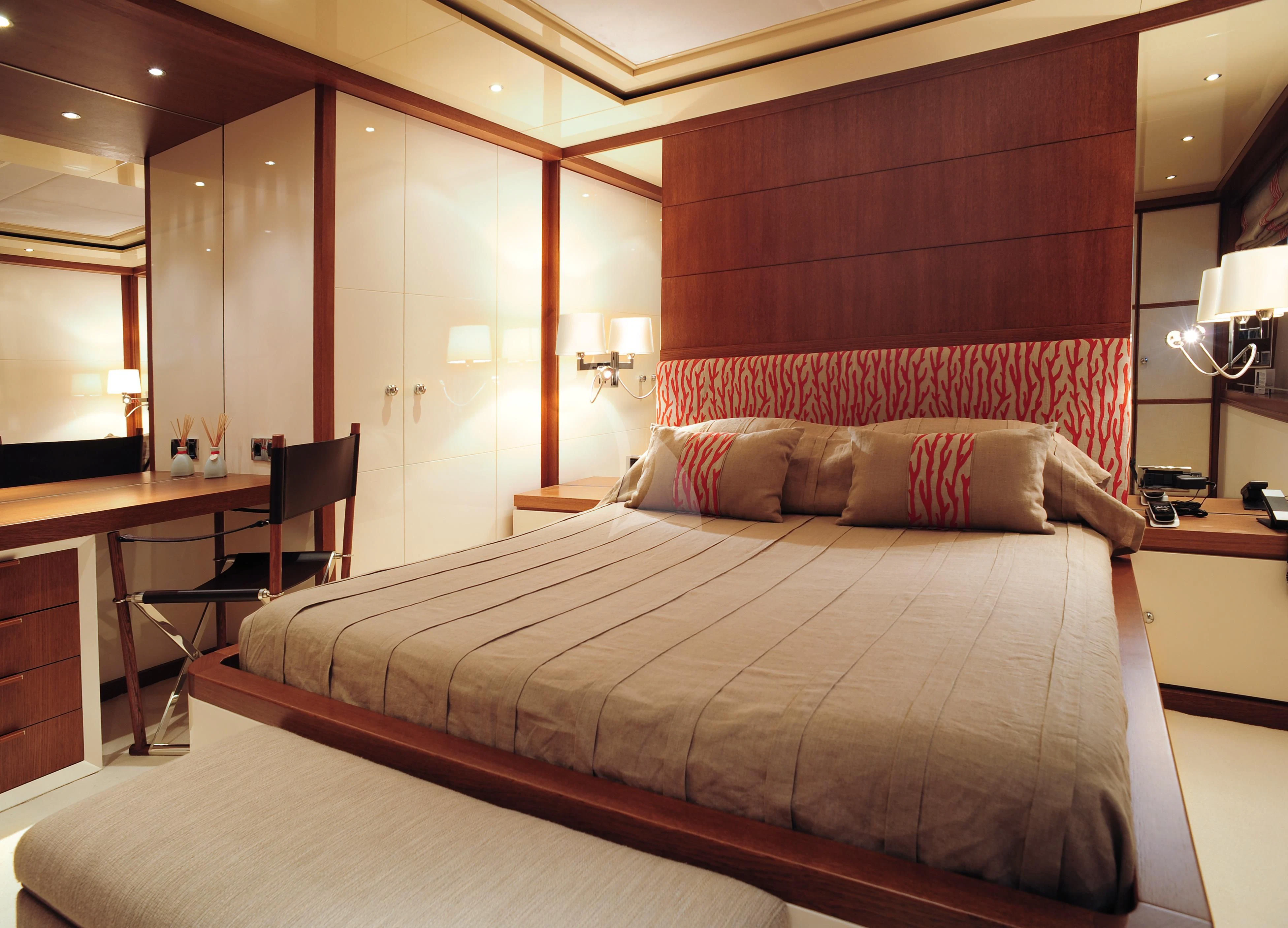 a bed in a hotel room aboard IRAVATI Yacht for Sale
