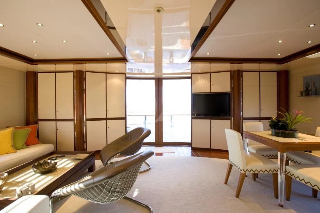 a living room with a large window aboard IRAVATI Yacht for Sale