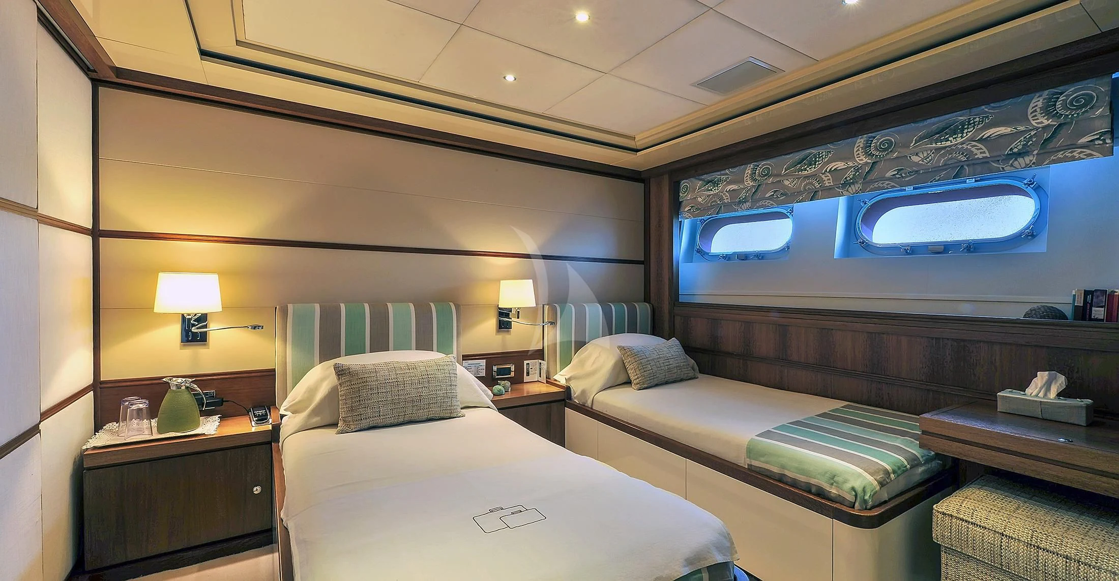 a room with two beds aboard IRAVATI Yacht for Sale