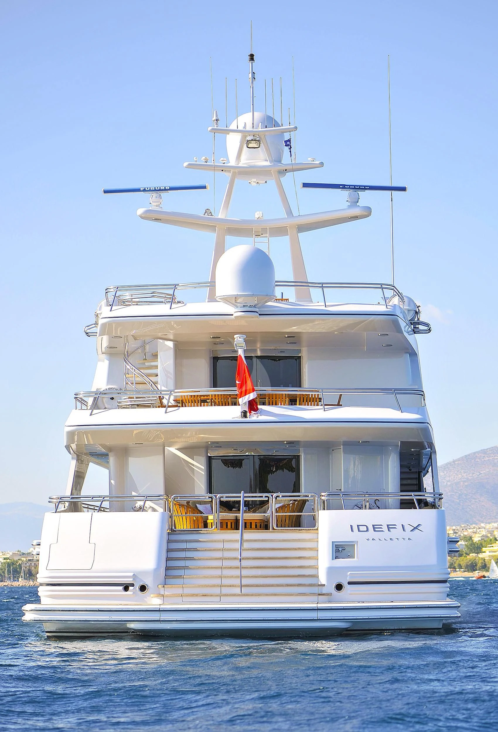 a large white boat with a satellite dish on top aboard IRAVATI Yacht for Sale
