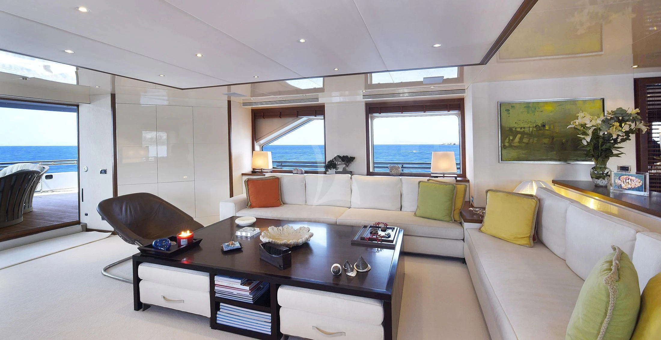 a living room with a large window aboard IRAVATI Yacht for Sale