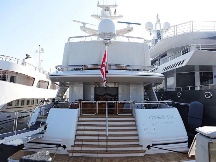 a boat with a red and white stripe on the deck aboard IRAVATI Yacht for Sale