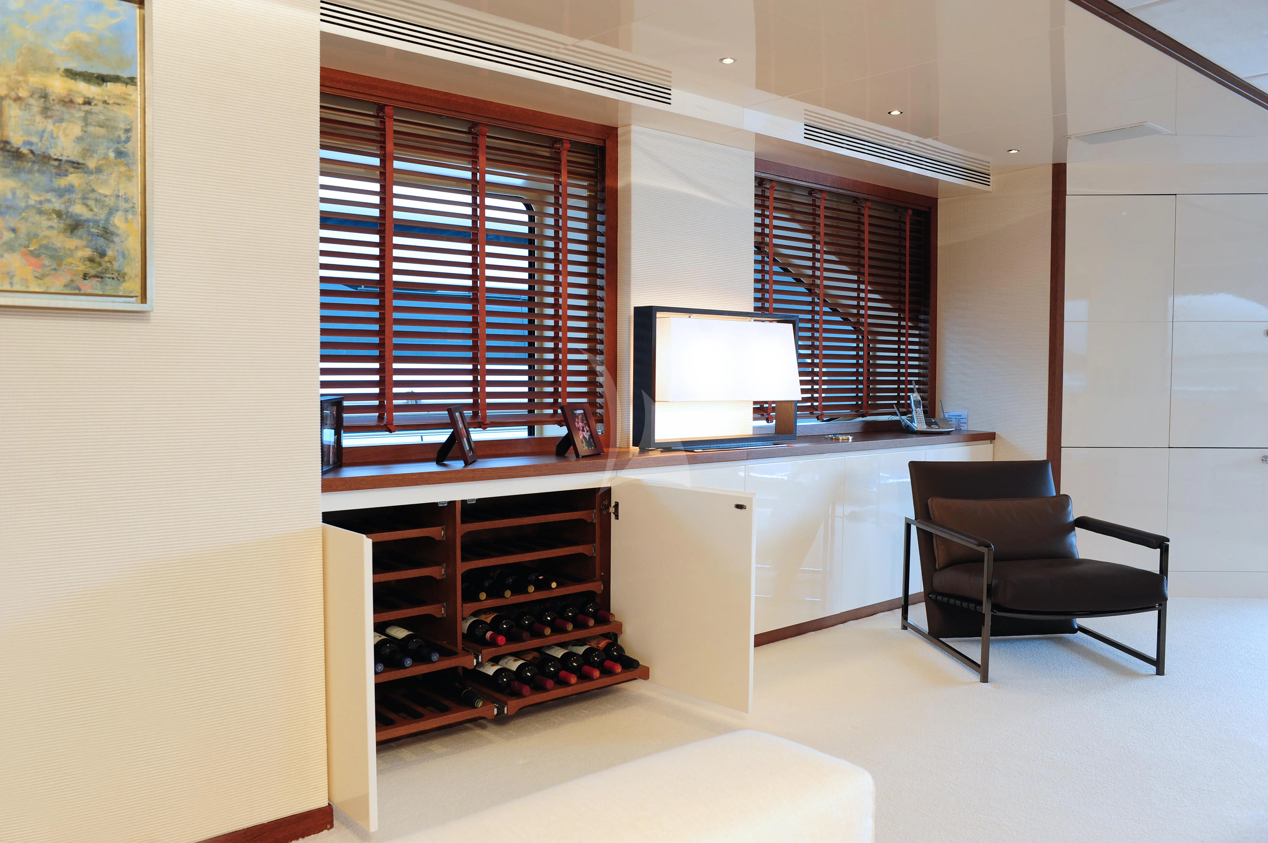 a room with a desk and a tv aboard IRAVATI Yacht for Sale