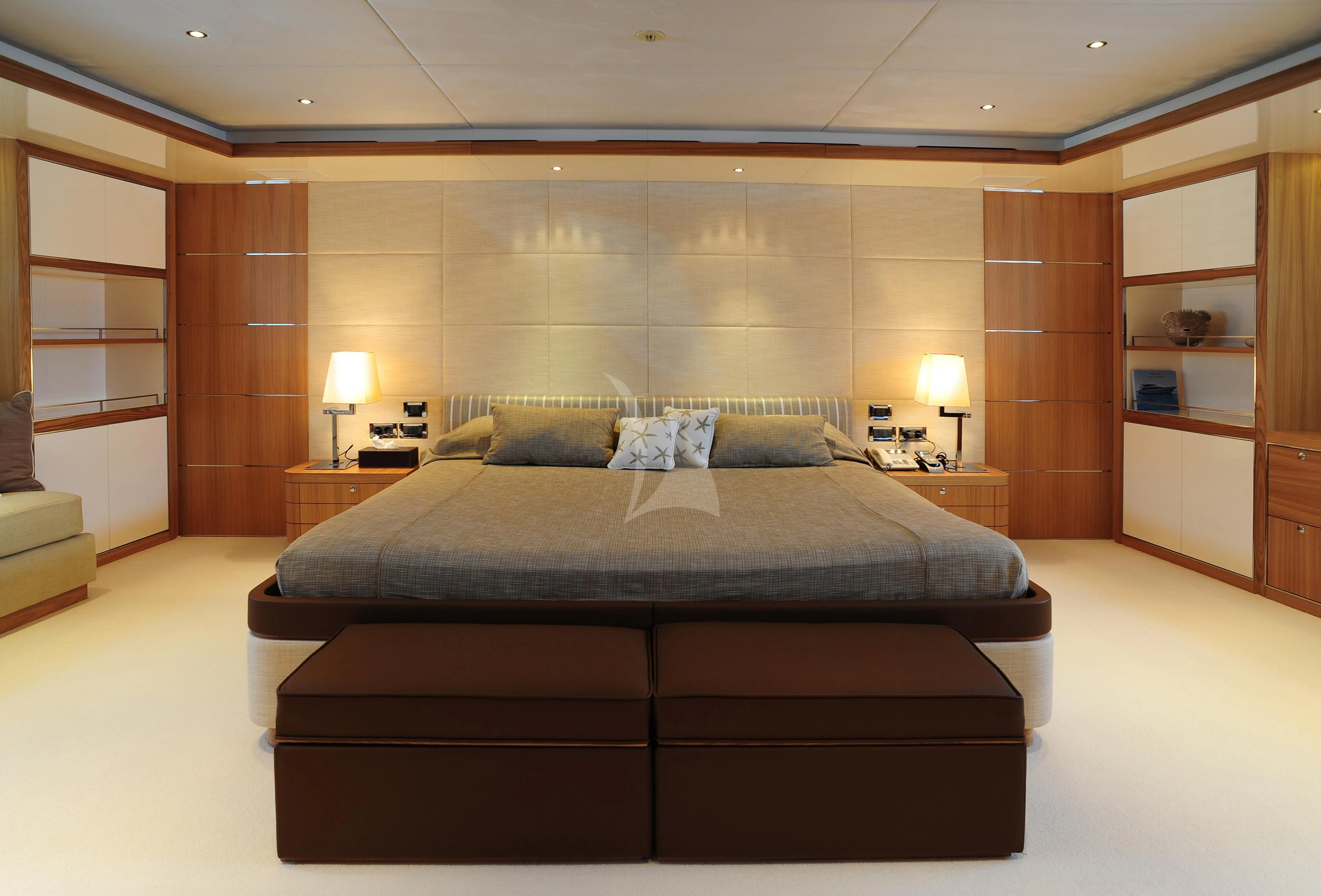 a large bed in a room aboard IRAVATI Yacht for Sale