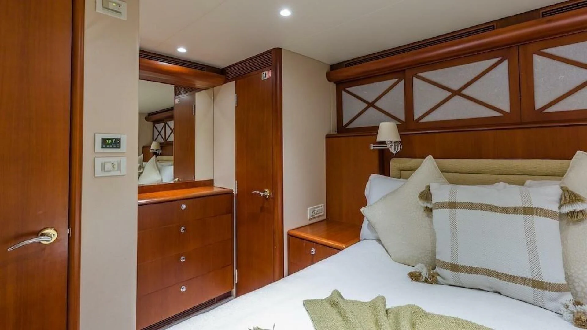 a bedroom with a bed and a closet aboard LADY LORRAINE Yacht for Sale