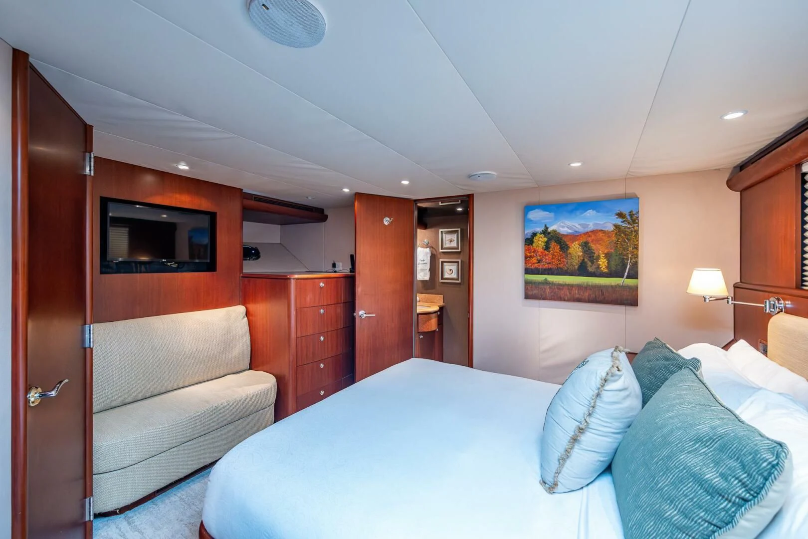 a hotel room with a bed and a television aboard LADY LORRAINE Yacht for Sale