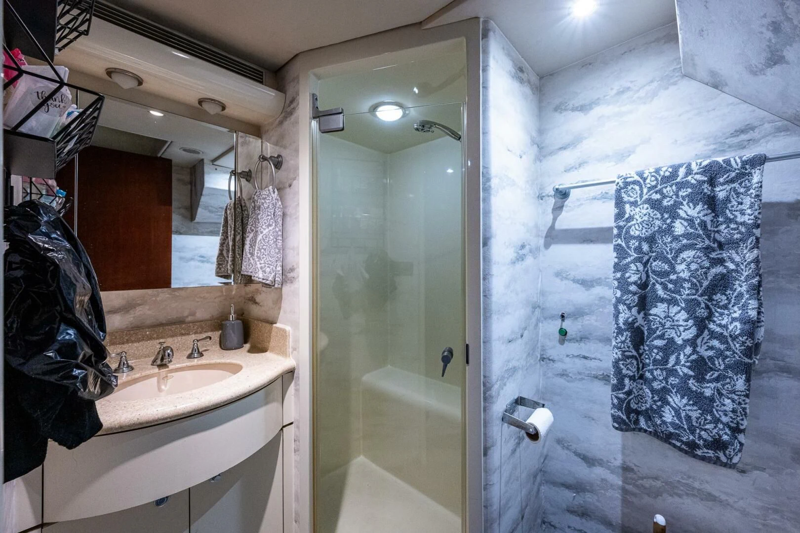 a bathroom with a sink and a mirror aboard LADY LORRAINE Yacht for Sale