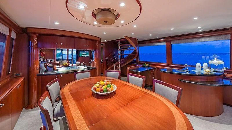 a room with a table and chairs aboard LADY LORRAINE Yacht for Sale