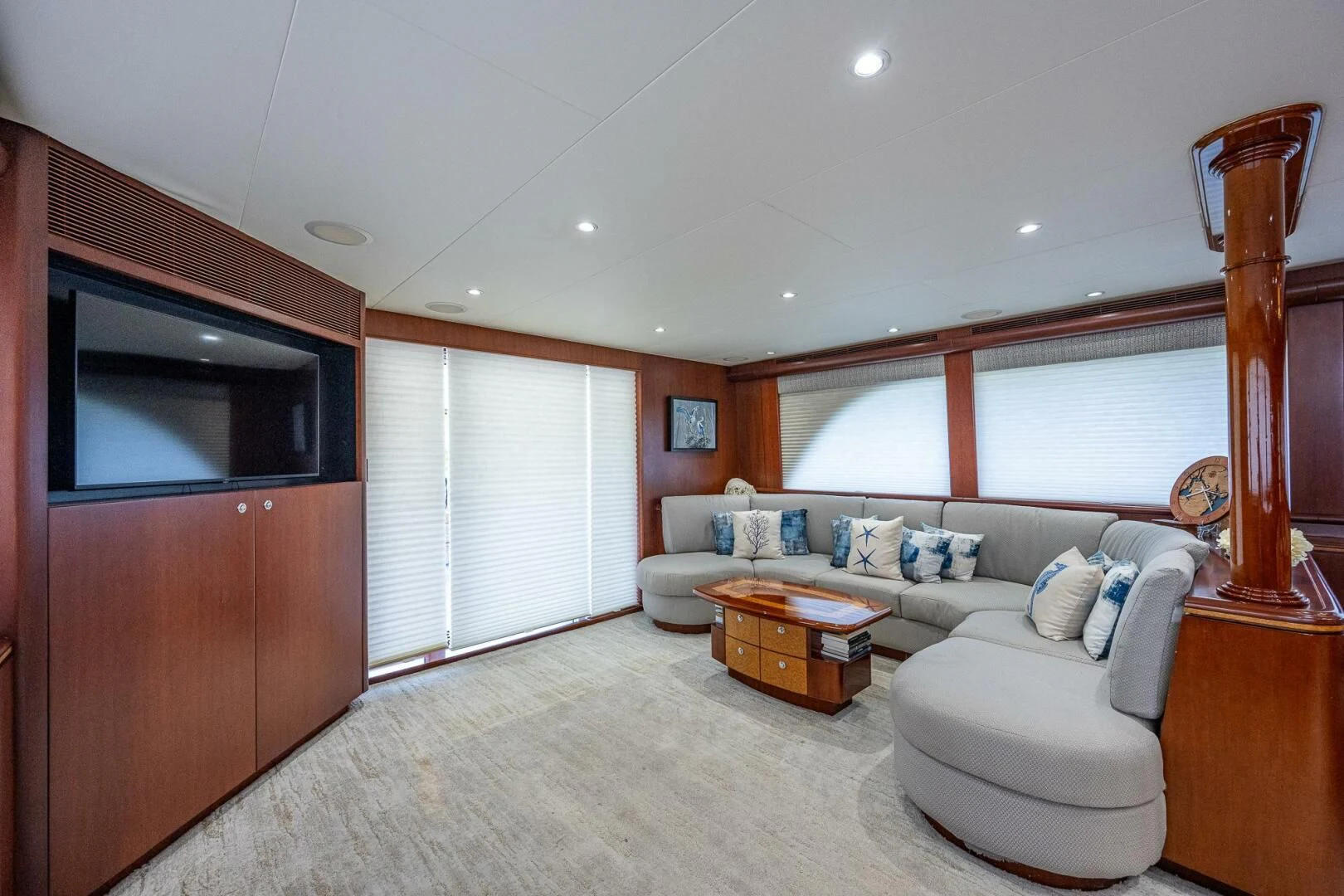 a living room with a couch and a tv aboard LADY LORRAINE Yacht for Sale