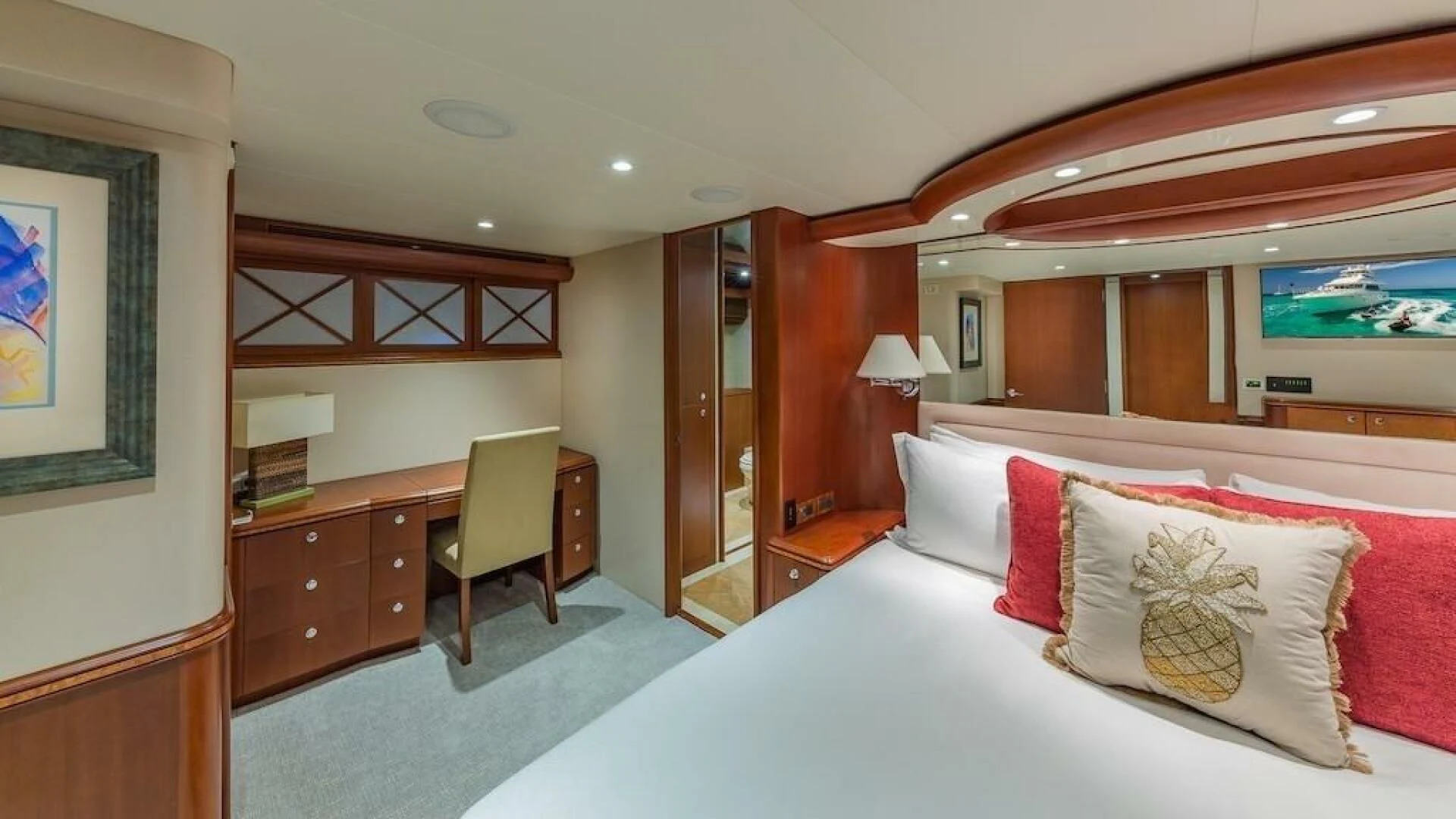 a hotel room with a bed and a chair aboard LADY LORRAINE Yacht for Sale