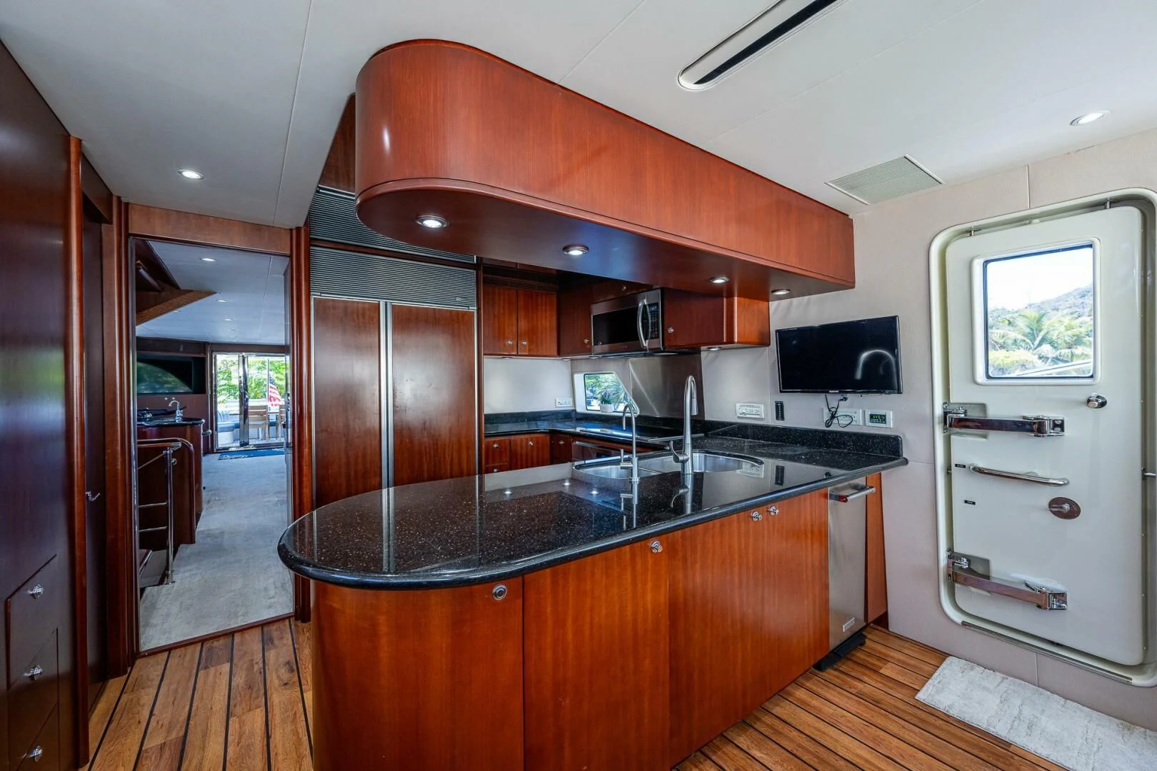 a kitchen with a large island aboard LADY LORRAINE Yacht for Sale