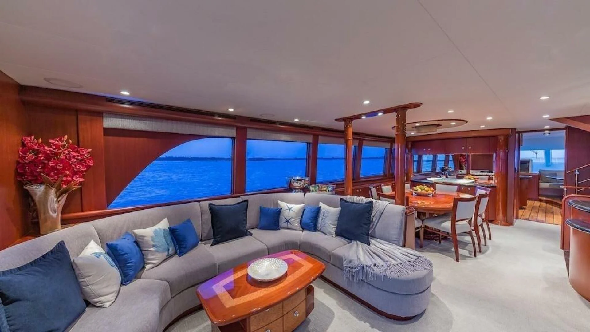a living room with a large window aboard LADY LORRAINE Yacht for Sale