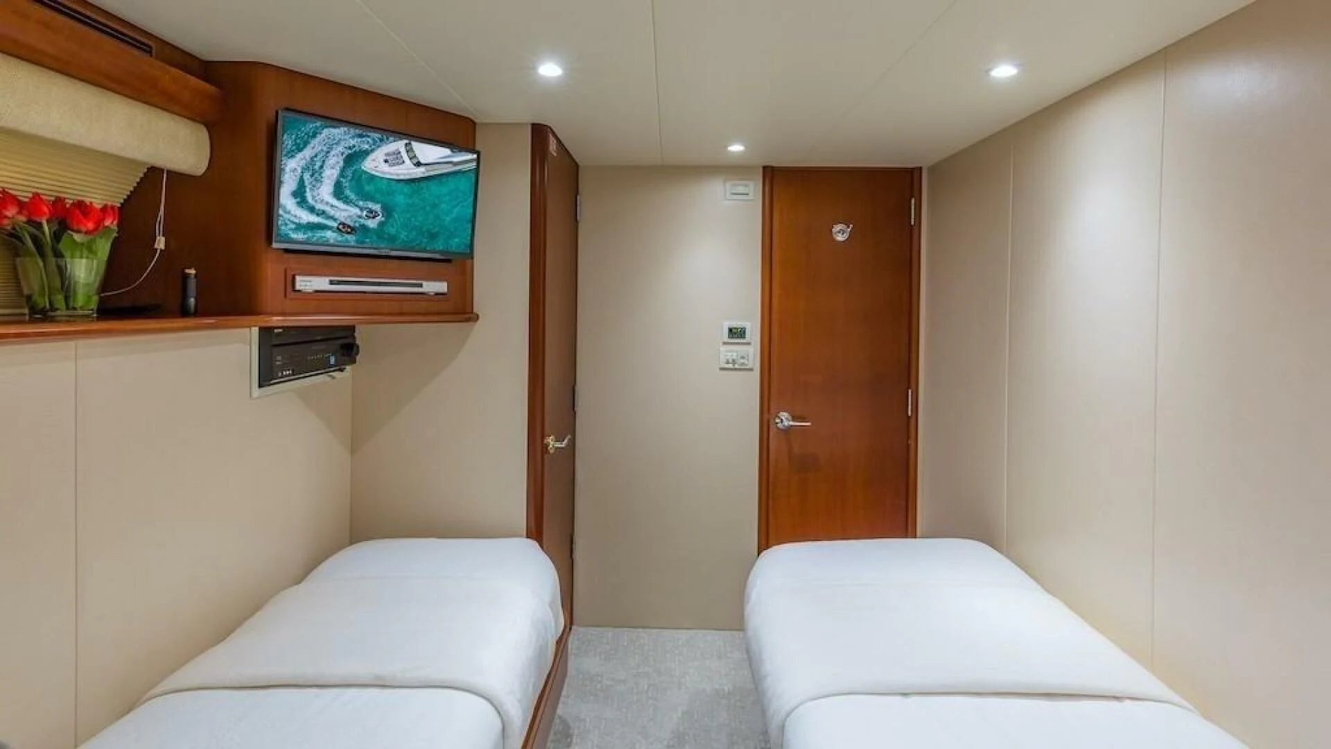 a room with a tv and furniture aboard LADY LORRAINE Yacht for Sale