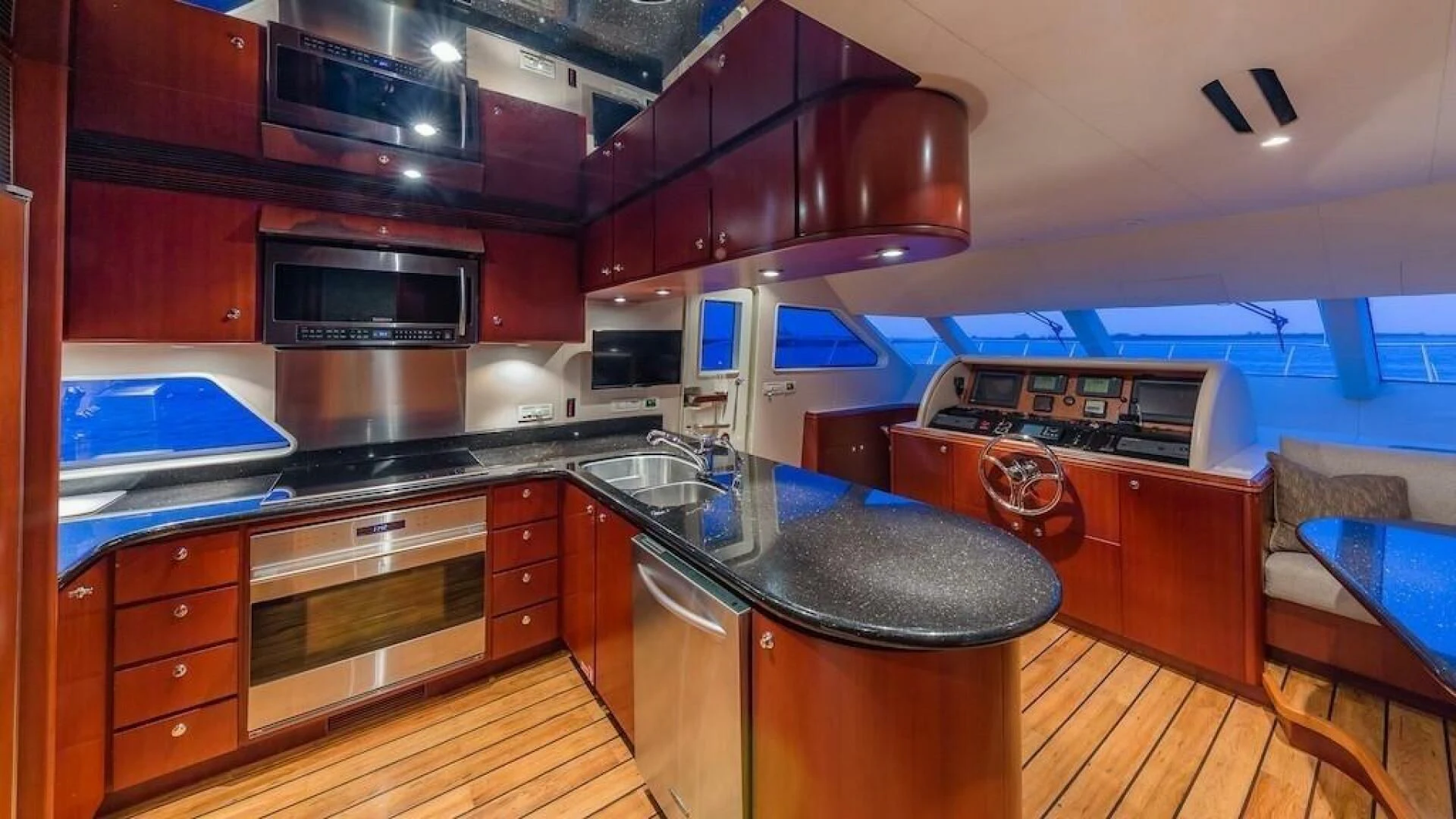 a kitchen with wooden cabinets aboard LADY LORRAINE Yacht for Sale