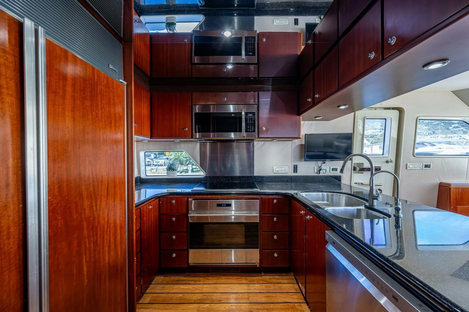 a kitchen with a sink and cabinets aboard LADY LORRAINE Yacht for Sale