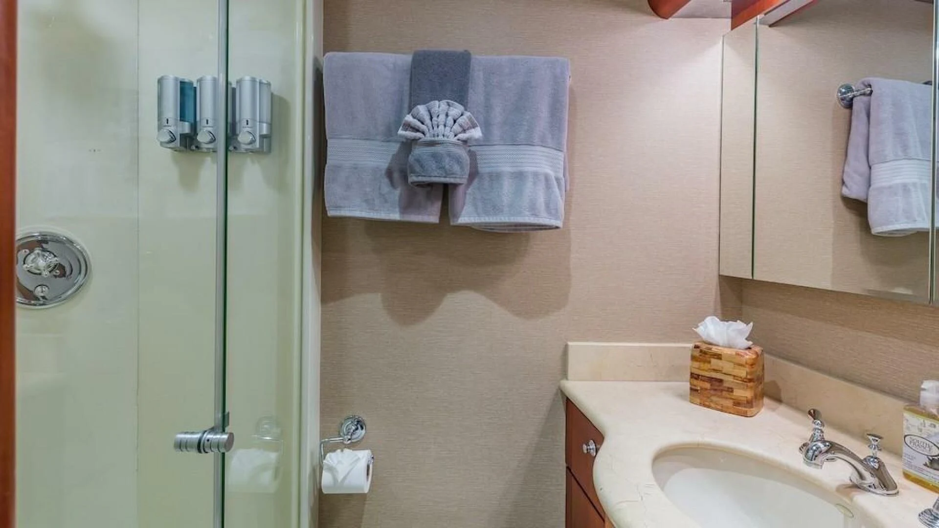 a bathroom with a shower unit and towels aboard LADY LORRAINE Yacht for Sale