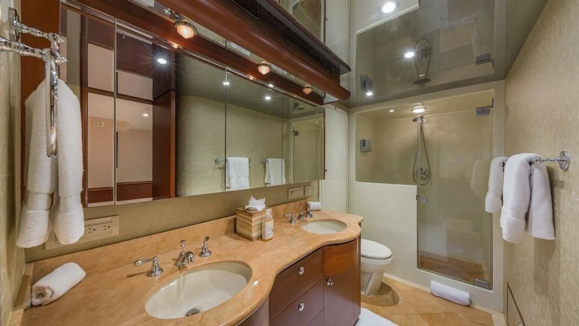 a bathroom with a large mirror aboard LADY LORRAINE Yacht for Sale