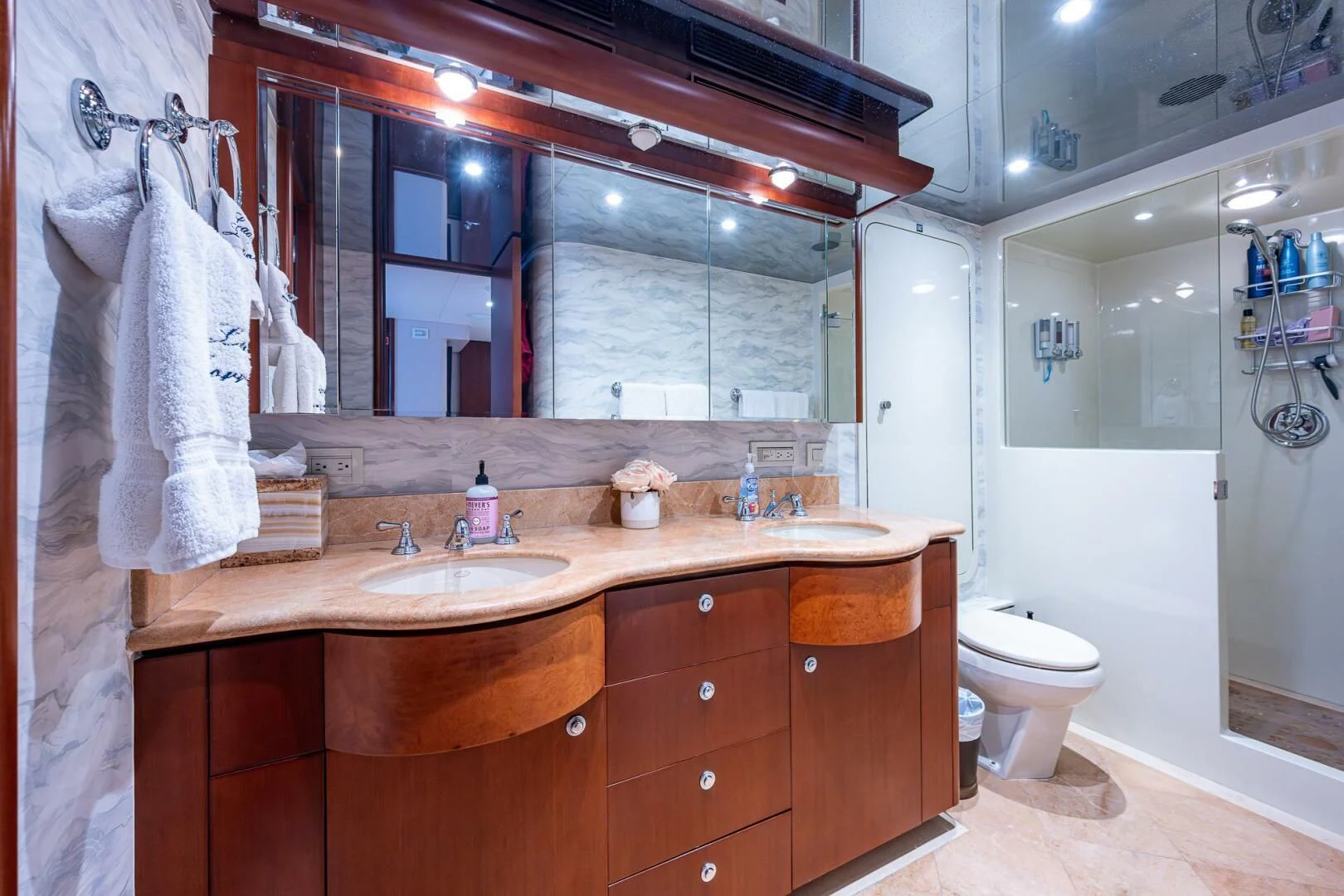 a bathroom with a sink and a mirror aboard LADY LORRAINE Yacht for Sale