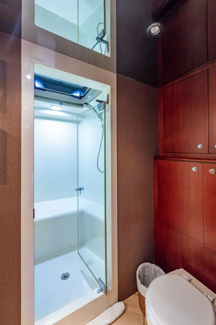 a bathroom with a shower unit and a toilet aboard LADY LORRAINE Yacht for Sale