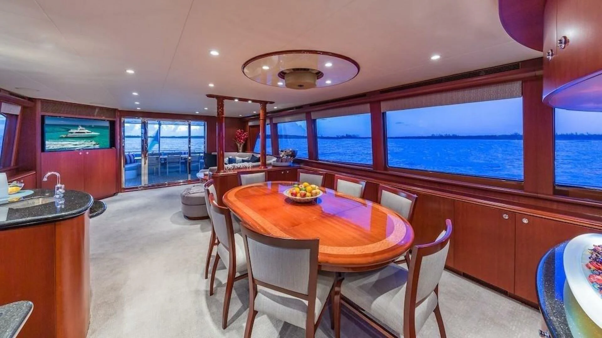 a dining room with a table and chairs aboard LADY LORRAINE Yacht for Sale
