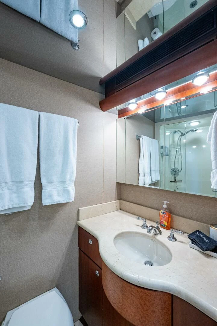 a bathroom with a mirror and a sink aboard LADY LORRAINE Yacht for Sale