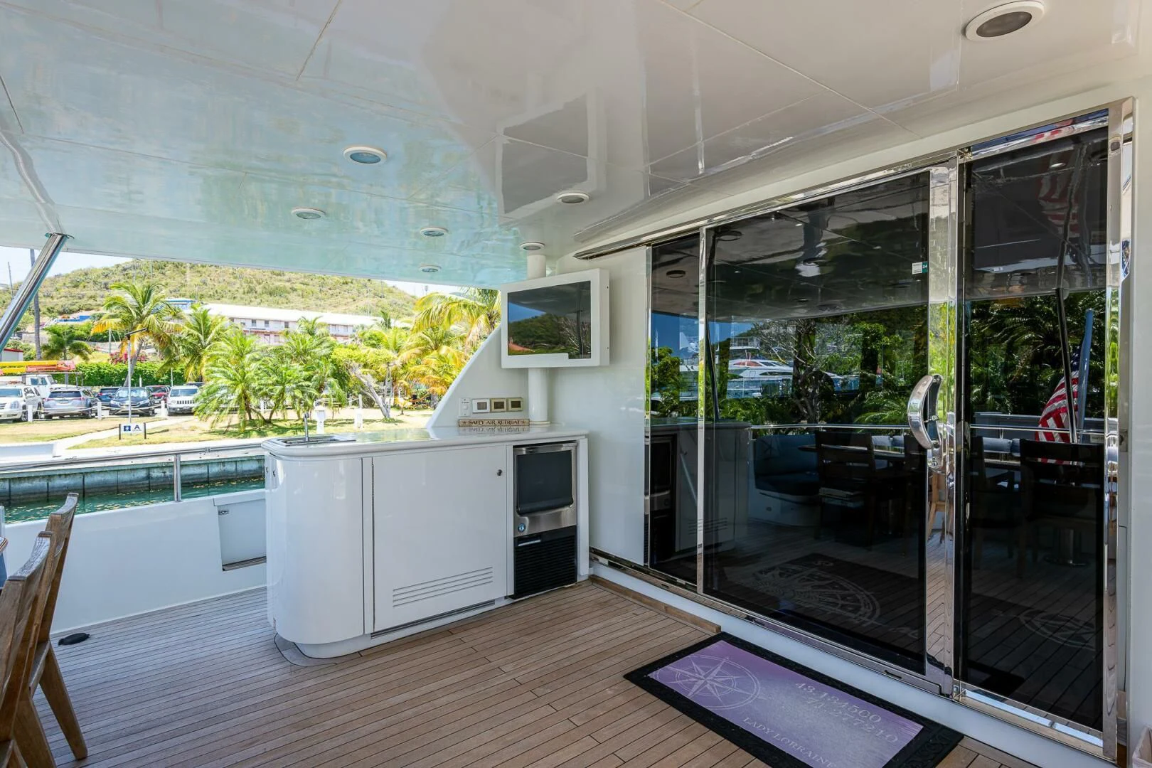 a room with a sliding glass door aboard LADY LORRAINE Yacht for Sale