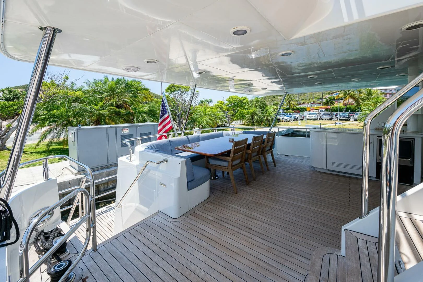 a deck with a table and chairs aboard LADY LORRAINE Yacht for Sale