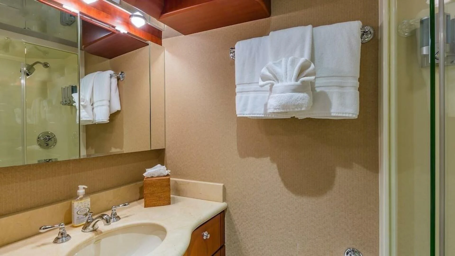 a bathroom with a large mirror aboard LADY LORRAINE Yacht for Sale